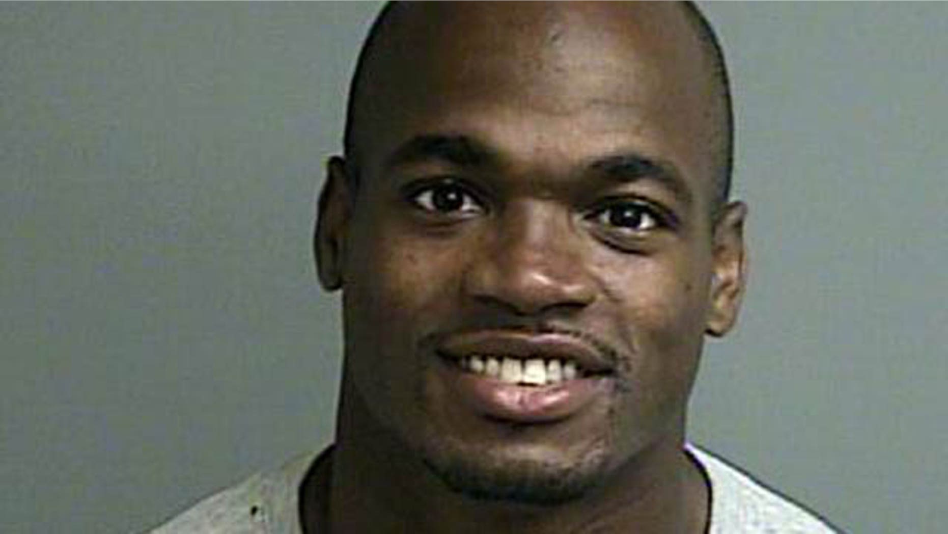 September 13, 2014: This photo provided by the Montgomery County sheriffs office shows the booking photo of Adrian Peterson. Peterson turned himself in early Saturday at a jail in Montgomery County, near Houston, where he has a home. He was processed and released. (AP Photo/Montgomery County sheriffs office)