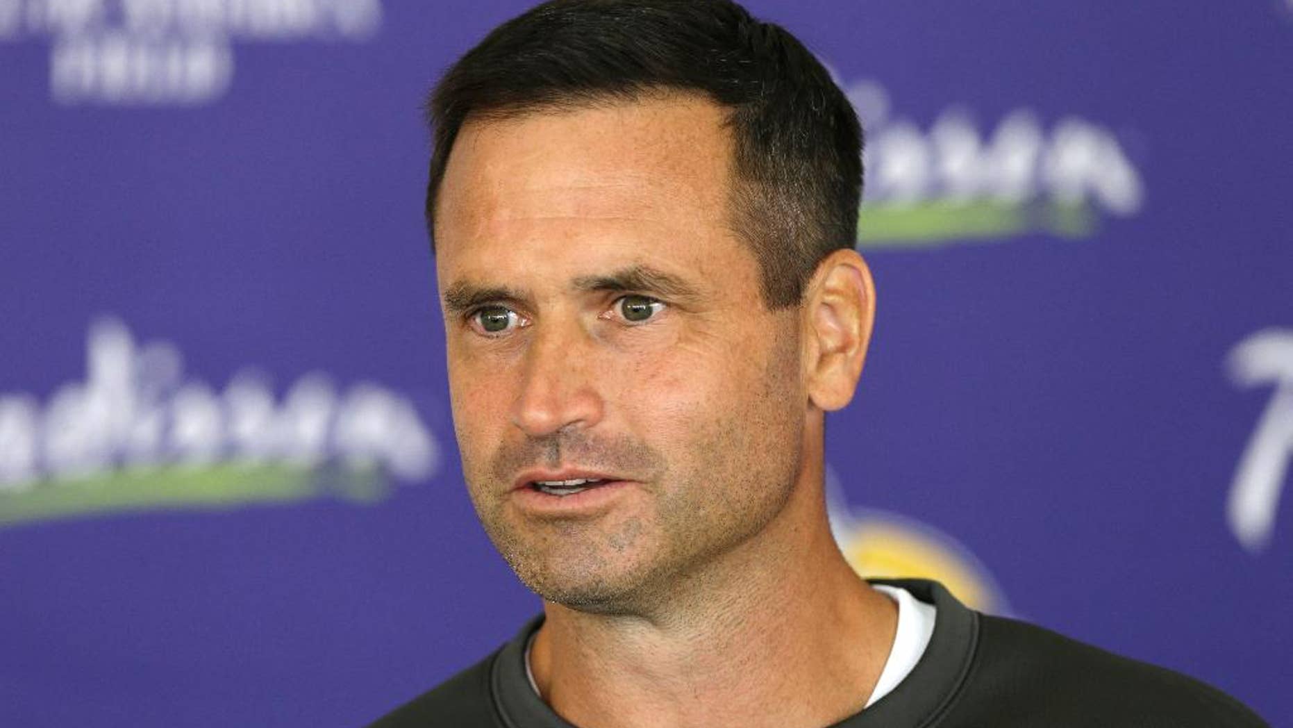 FILE - In this July 27, 2013 file photo, Minnesota Vikings special teams coordinator Mike Priefer speaks to reporters following practice at NFL football training camp in Mankato, Minn. Once again, the Vikings are reporting to training camp with some sort of swirling controversy or off-the-field distraction to address. This time, it's the lawsuit brought by former punter Chris Kluwe over alleged discrimination, following a six-month investigation that resulted in a three-game suspension of Priefer for an anti-gay remark. (AP Photo/Charlie Neibergall, File)
