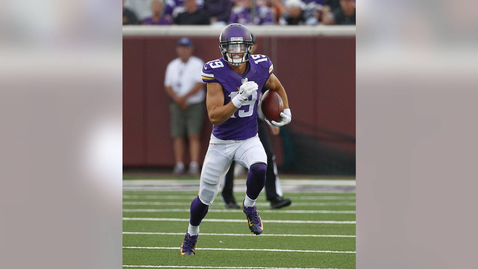 FILE - In this Aug. 8, 2014, file photo, Minnesota Vikings wide receiver Adam Thielen (19) runs the ball against the Oakland Raiders in the first half of a preseason NFL football game at TCF Bank Stadium in Minneapolis. After making a strong enough impression as an undrafted rookie last year to land a spot on the practice squad with the Vikings, Thielen has put himself in position to make the active roster this season. (AP Photo/Ann Heisenfelt, File)