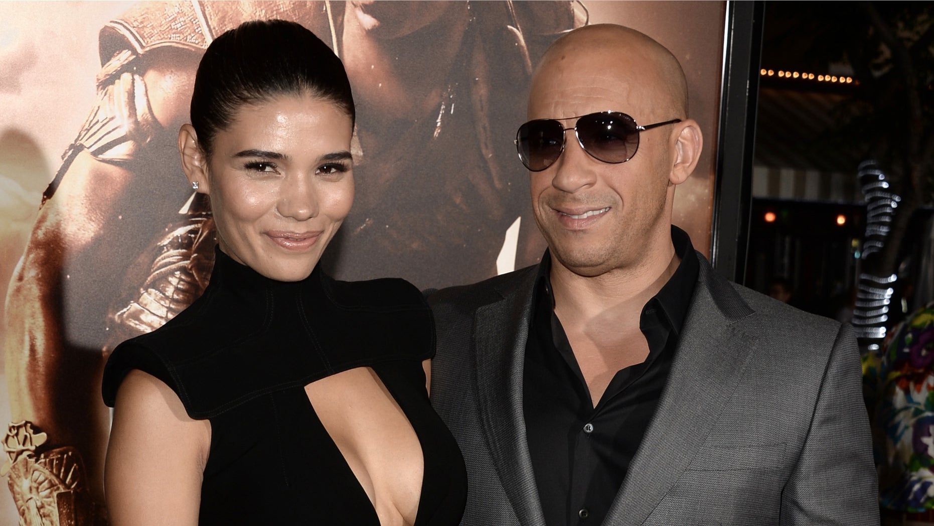 WESTWOOD, CA - AUGUST 28: Actor Vin Diesel (R) and model Paloma Jimenez attend the premiere of Universal Pictures' "Riddick" at Mann Village Theatre on August 28, 2013 in Westwood, California. (Photo by Kevin Winter/Getty Images)
