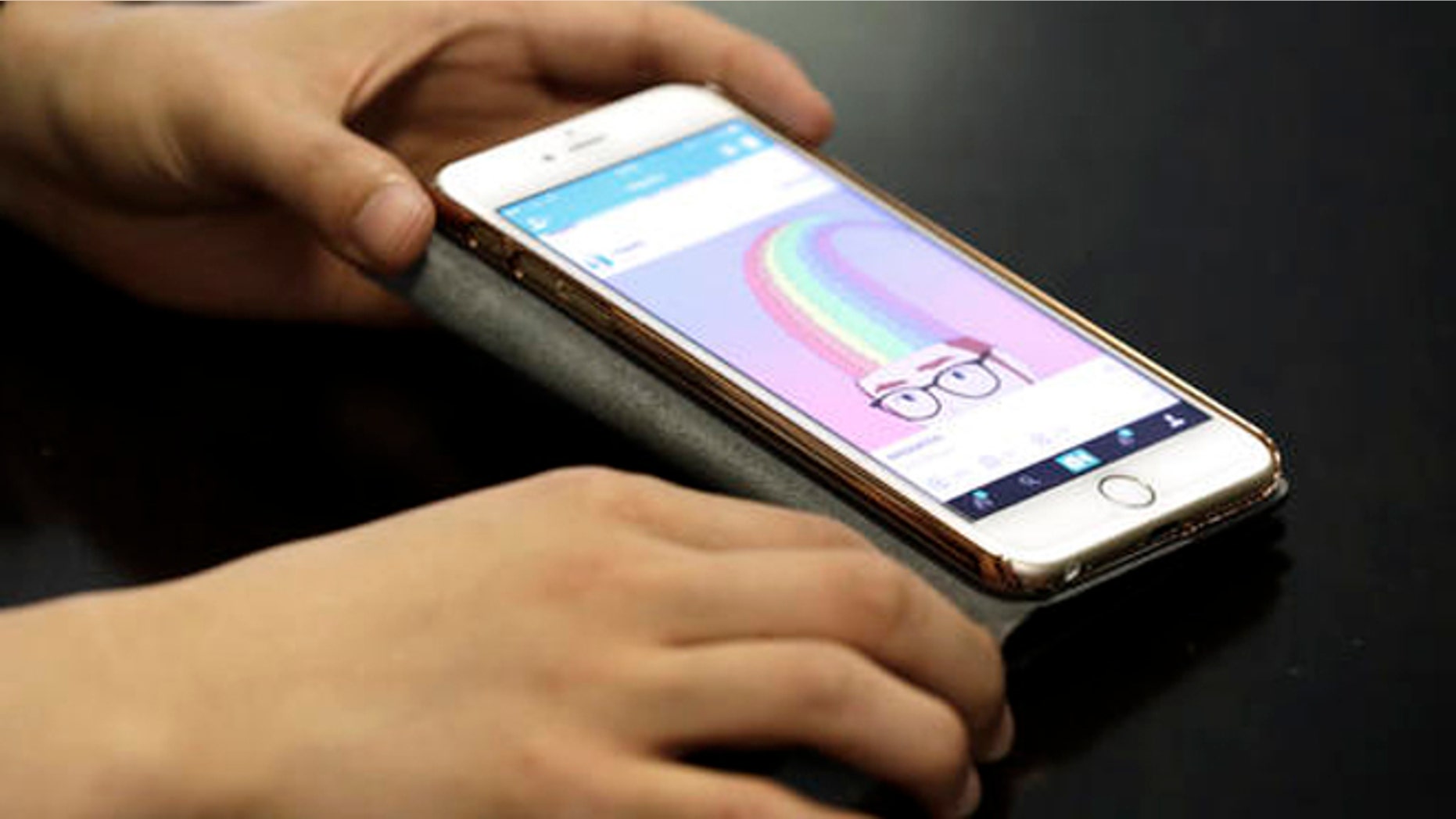 FILE - In this June 30, 2016, file photo, Hayatto Noguchi, Japanese Vine artist, shows his work on a smartphone during an interview with The Associated Press in Tokyo. Twitter has decided to shut down the Vine video app, which has been eclipsed by the likes of Instagram and Snapchat even as it remains beloved by a loyal fan base. (AP Photo/Eugene Hoshiko, File)