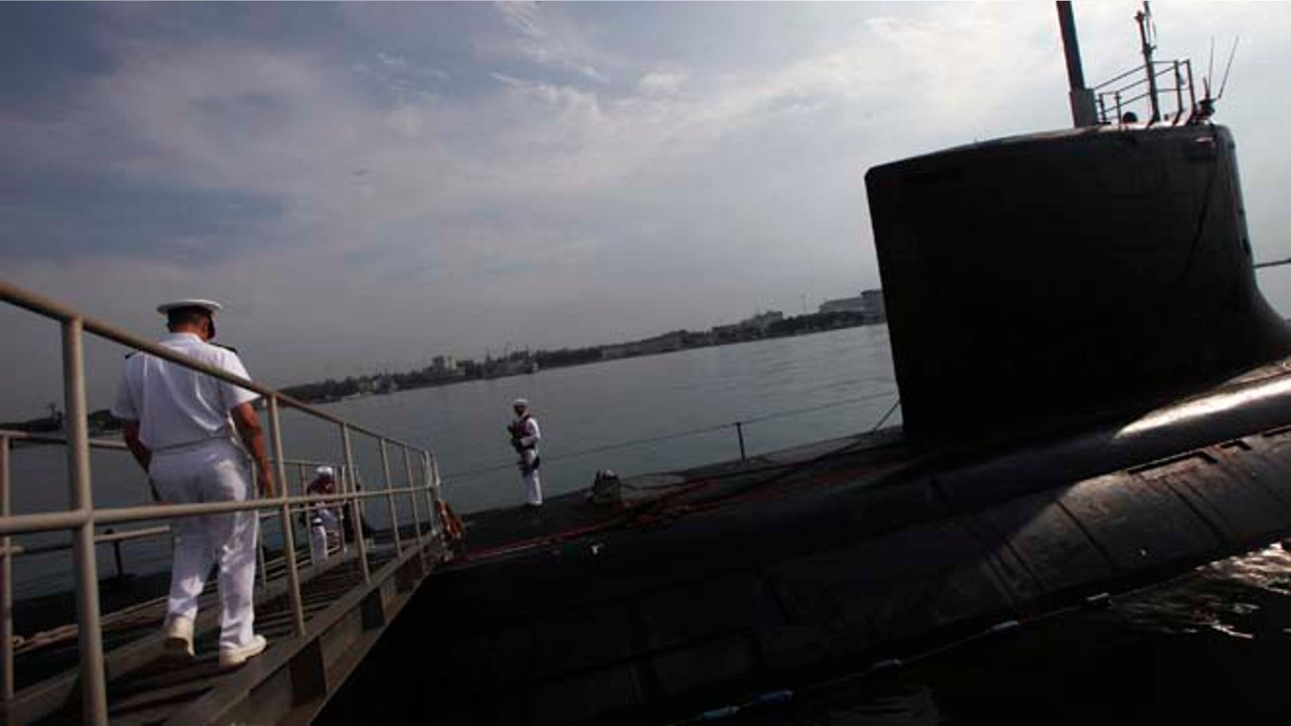 FILE: USS North Carolina is a VIrginia-class submarine docked at Changi Naval Base in Singapore. The Russian navy believes it chased a similar sub from the Barents Sea, according to reports.