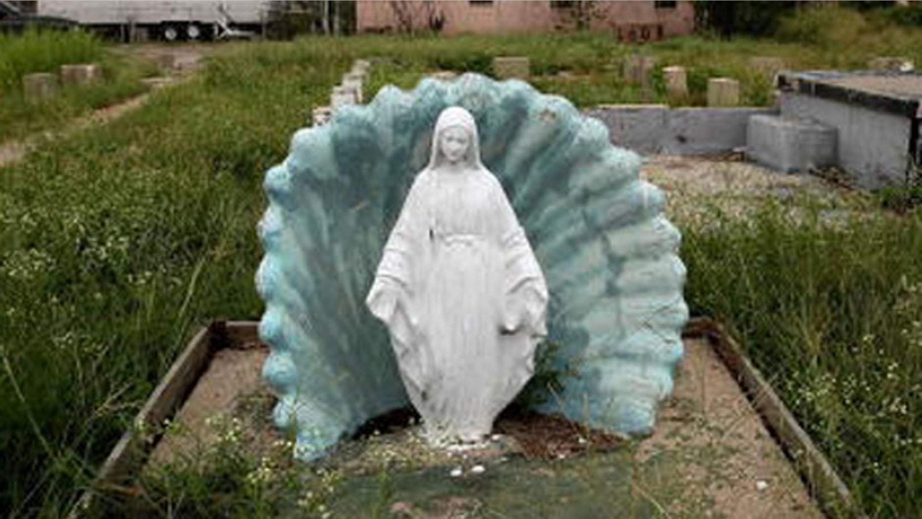 NEW ORLEANS - AUGUST 27: A Virgin Mary statue is seen in front of the foundation of a destroyed house in the Lower Ninth Ward August 27, 2007 in New Orleans, Louisiana. Nature has reclaimed much of the land in the hardest hit section of the Lower Ninth. The second anniversary of Hurricane Katrina is August 29. (Photo by Mario Tama/Getty Images)