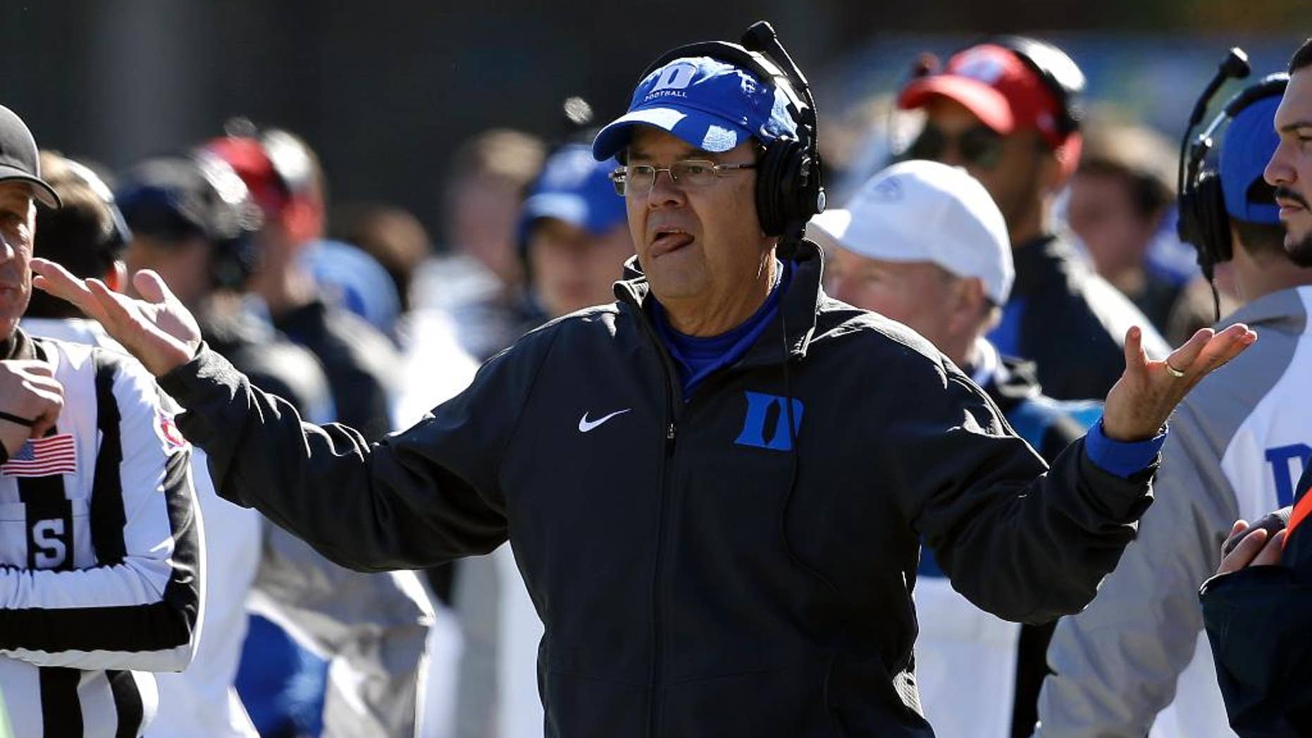 Duke coach David Cutcliffe reacts during the first half of an NCAA college football game against Virginia Tech in Durham, N.C., Saturday, Nov. 15, 2014. Virginia Tech won 17-16. (AP Photo/Gerry Broome)