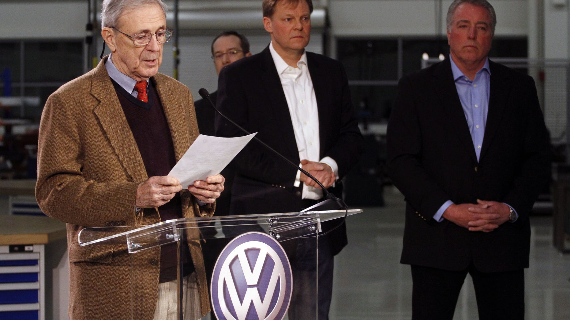 Retired circuit judge Sam Payne, left, announces that Volkswagen employees voted to deny representation by the United Auto Workers union as Frank Fischer, Chairman and CEO of the Volkswagen Group of America, center, and Gary Casteel, UAW Region 8 Director, look on from behind, concluding a three day election which ended this evening Friday, Feb. 14, 2014, in Chattanooga, Tenn. (AP Photo/Chattanooga Times Free Press, Dan Henry) THE DAILY CITIZEN OUT; NOOGA.COM OUT; CLEVELAND DAILY BANNER OUT; LOCAL INTERNET OUT