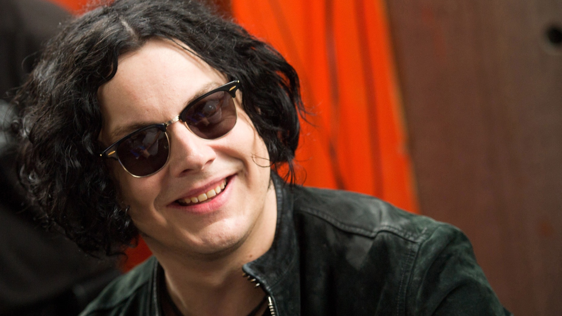 June 24, 2011: Jack White signs copies of the record he made with Stephen Colbert in New York.