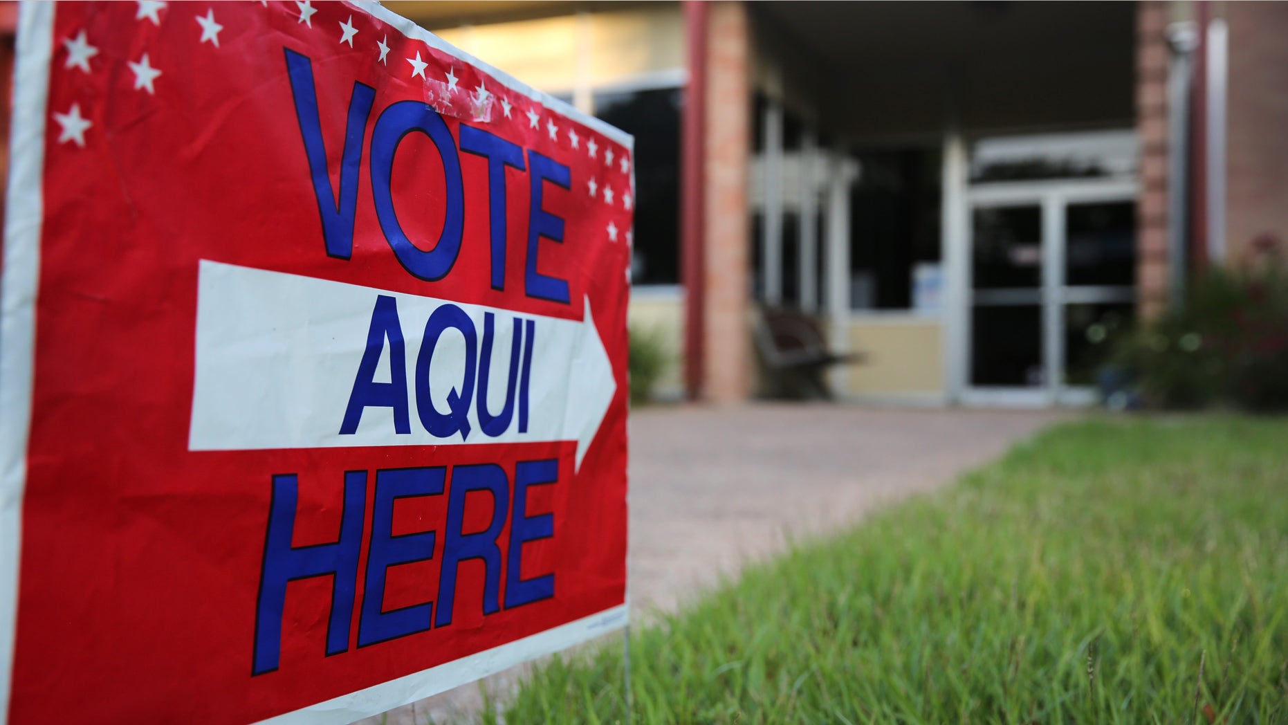 AUSTIN, TX - APRIL 28: A bilingual sign stands outside a polling center at public library ahead of local elections on April 28, 2013 in Austin, Texas. Early voting was due to begin Monday ahead of May 11 statewide county elections. The Democratic and Republican parties are vying for the Latino vote nationwide following President Obama's landslide victory among Hispanic voters in the 2012 election. (Photo by John Moore/Getty Images)