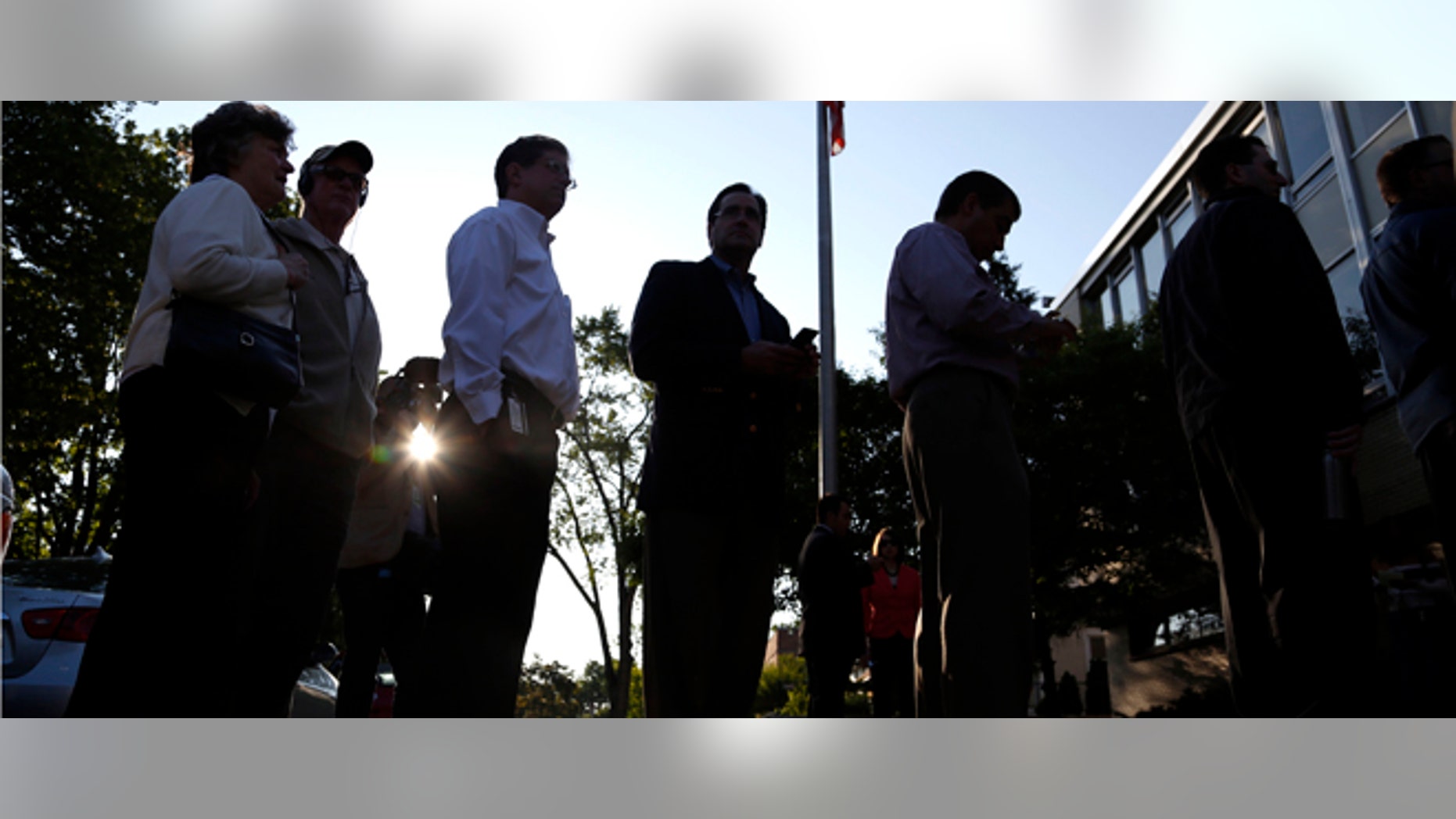 WAUWATOSA, WI - JUNE 5: Voters wait in line to cast their ballots outside Jefferson School to vote in the gubernatorial recall election June 5, 2012 in Wauwatosa, Wisconsin. Voters were lined up before the polls opened at 7:00 AM to decide on the recall race between the Republican Wisconsin Gov. Scott Walker and Democratic Milwaukee Mayor Tom Barrett. (Photo by Tom Lynn/Getty Images)