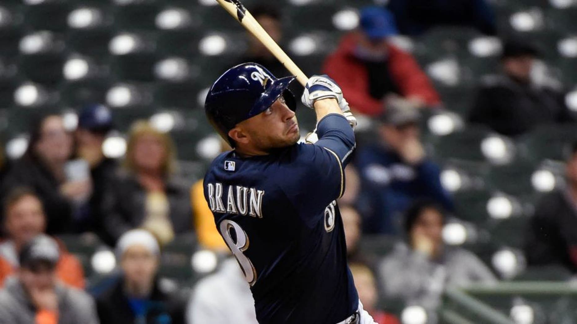 Monday, April 20: Milwaukee Brewers right fielder Ryan Braun hits a solo home run in the ninth inning against the Cincinnati Reds at Miller Park. The Brewers lost 6-1.