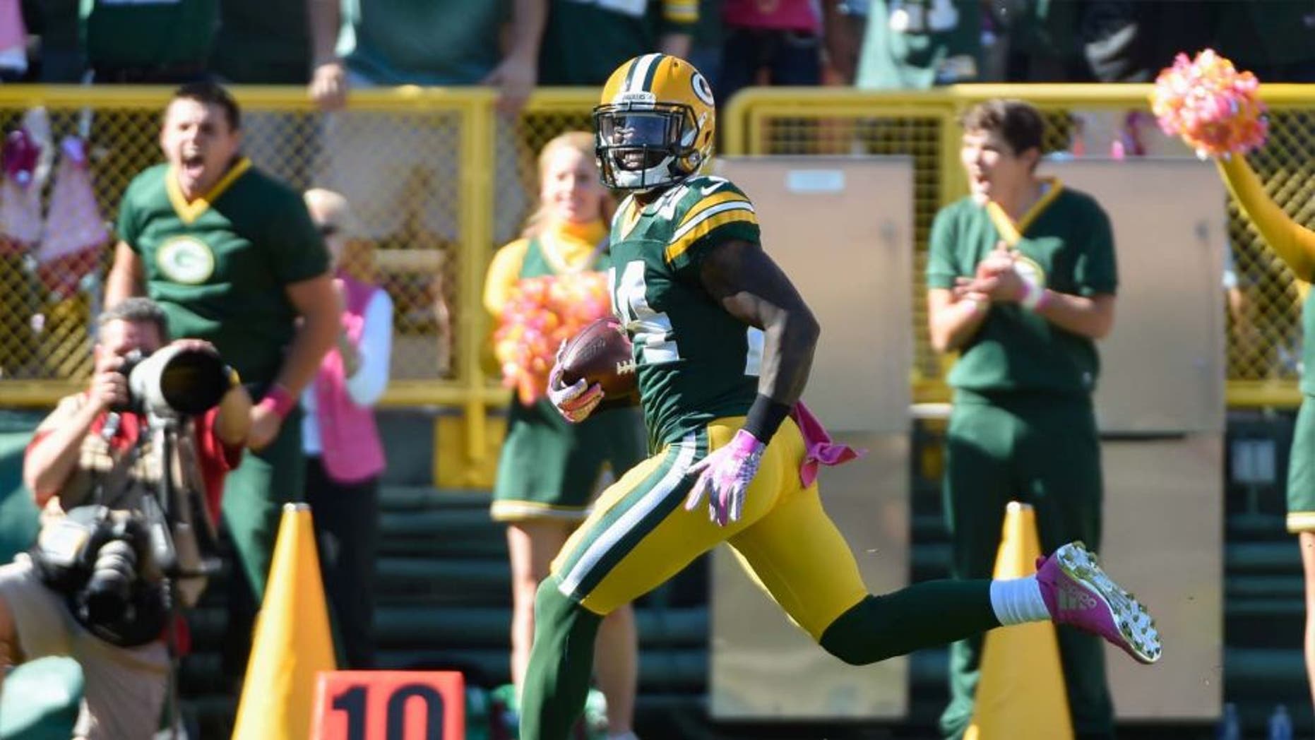 Sunday, Oct. 11: Green Bay Packers cornerback Quinten Rollins returns an interception for a touchdown in the first quarter against the St. Louis Rams at Lambeau Field in Green Bay, Wis.
