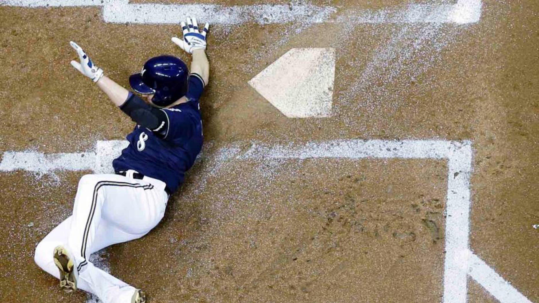 Tuesday, Sept. 1: The Milwaukee Brewers' Ryan Braun slides safely home during the first inning against the Pittsburgh Pirates in Milwaukee. Braun scored from first on a double by Adam Lind.