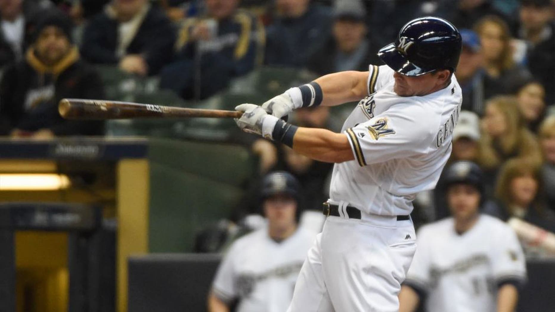 Monday, April 4: Milwaukee Brewers second baseman Scooter Gennett hits a solo home run in the second inning against the San Francisco Giants at Miller Park in Milwaukee.