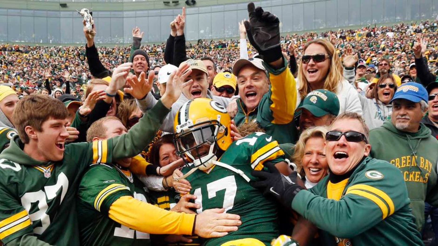 Sunday, October 19: The Green Bay Packers' Davante Adams celebrates his touchdown catch with fans during the second half against the Carolina Panthers.