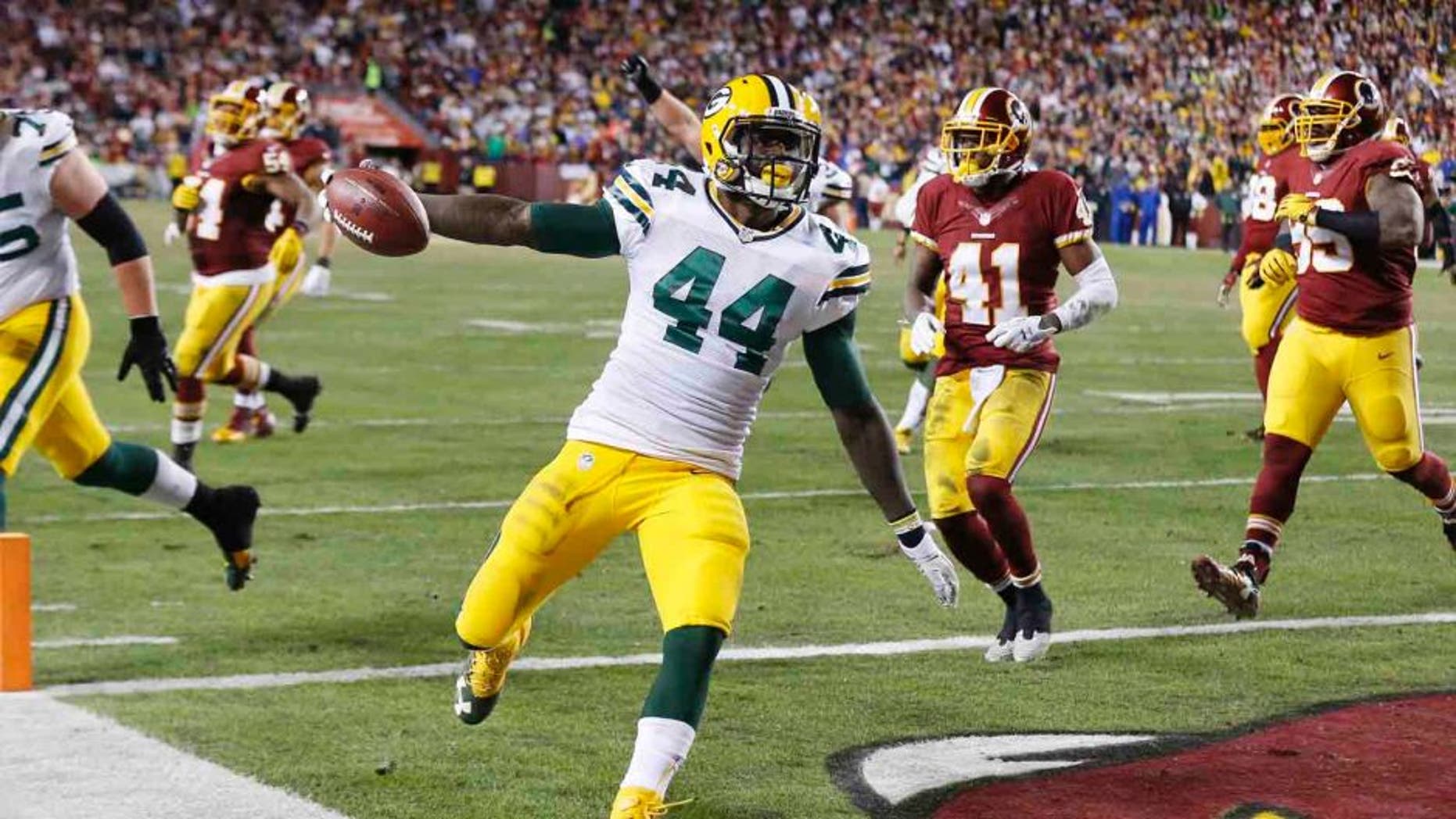 Sunday, Jan. 10: Green Bay Packers running back James Starks scores a touchdown against the Washington Redskins during the second half at FedEx Field in Landover, Md.