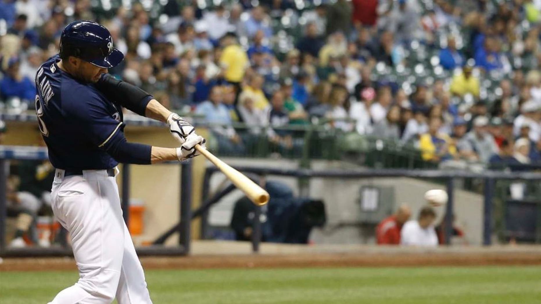 Tuesday, June 7: The Milwaukee Brewers' Ryan Braun hits a single for his 1,500th career hit during the sixth inning against the Oakland Athletics in Milwaukee. The Brewers won 5-4.