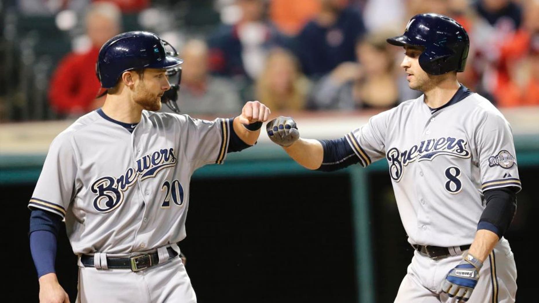 Tuesday, Aug. 25: The Milwaukee Brewers' Ryan Braun (right) is congratulated by Jonathan Lucroy after Braun hit a two-run home run off Cleveland Indians starting pitcher Josh Tomlin in the sixth inning in Cleveland.