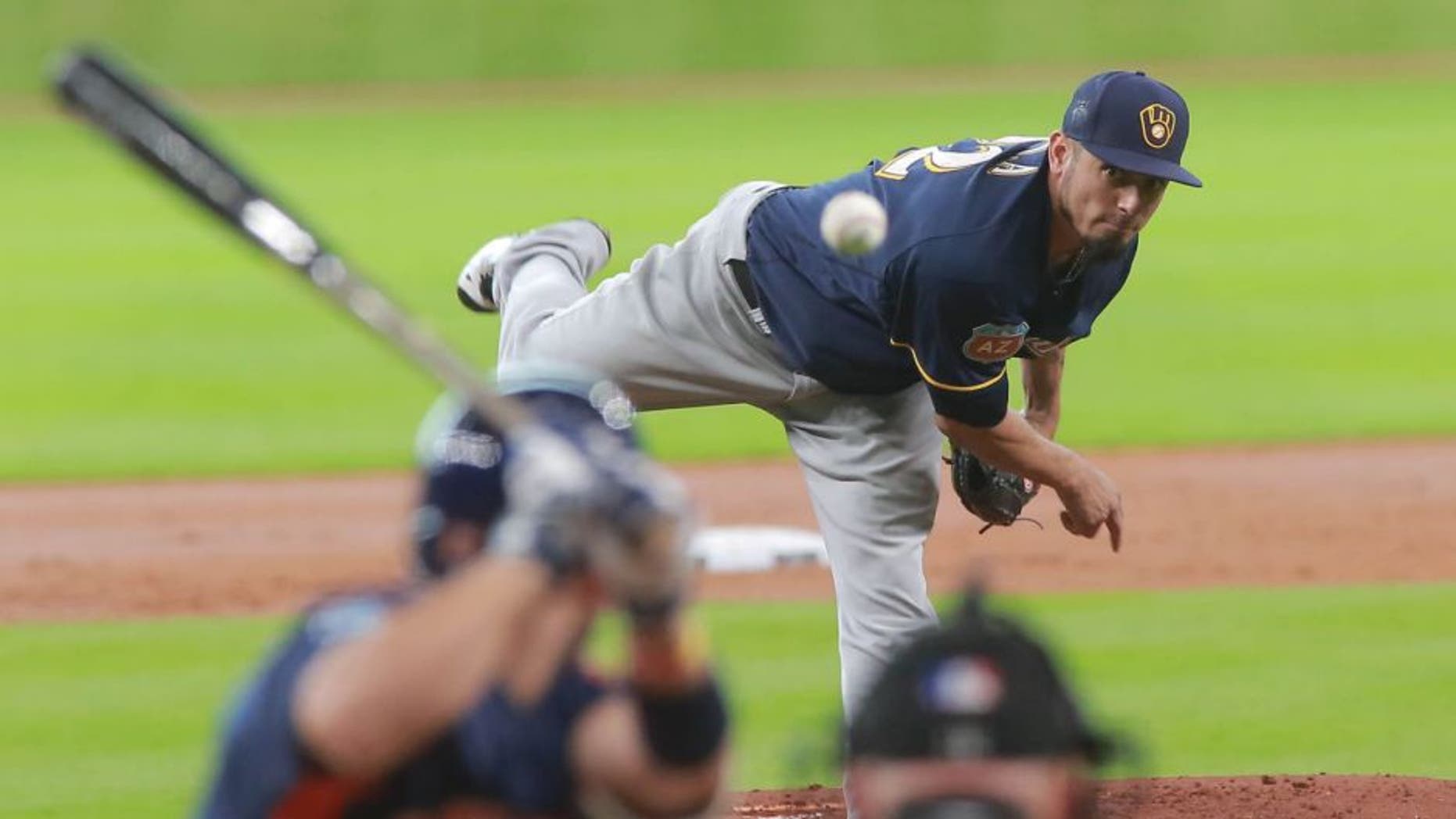 Friday, April 1: Milwaukee Brewers pitcher Matt Garza delivers a pitch to the Houston Astros' Jose Altuve in the first inning of an exhibition baseball game in Houston.