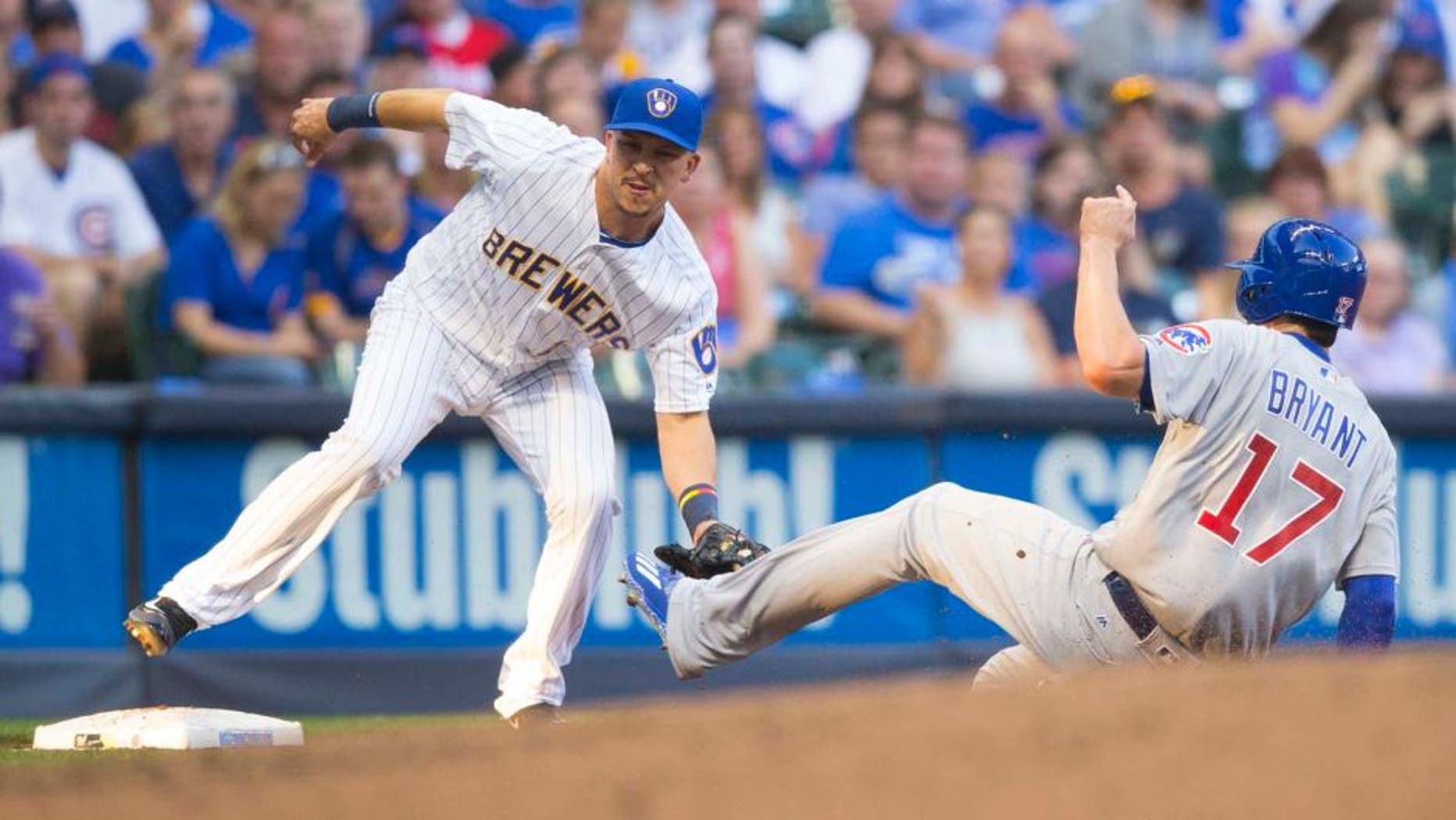 Friday, July 22, 2016: Milwaukee Brewers third baseman Hernan Perez (left) tags out Chicago Cubs third baseman Kris Bryant at third base during the second inning at Miller Park. The Brewers lost 5-2.