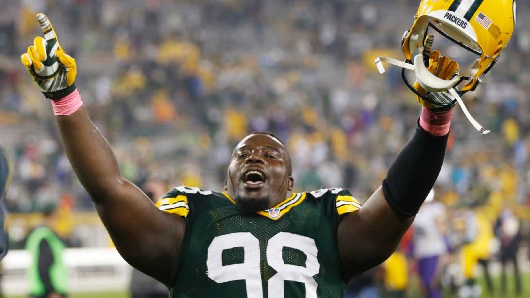 Thursday, October 2: The Green Bay Packers' Letroy Guion celebrates after the game against the Minnesota Vikings in Green Bay, Wis. The Packers won 42-10.