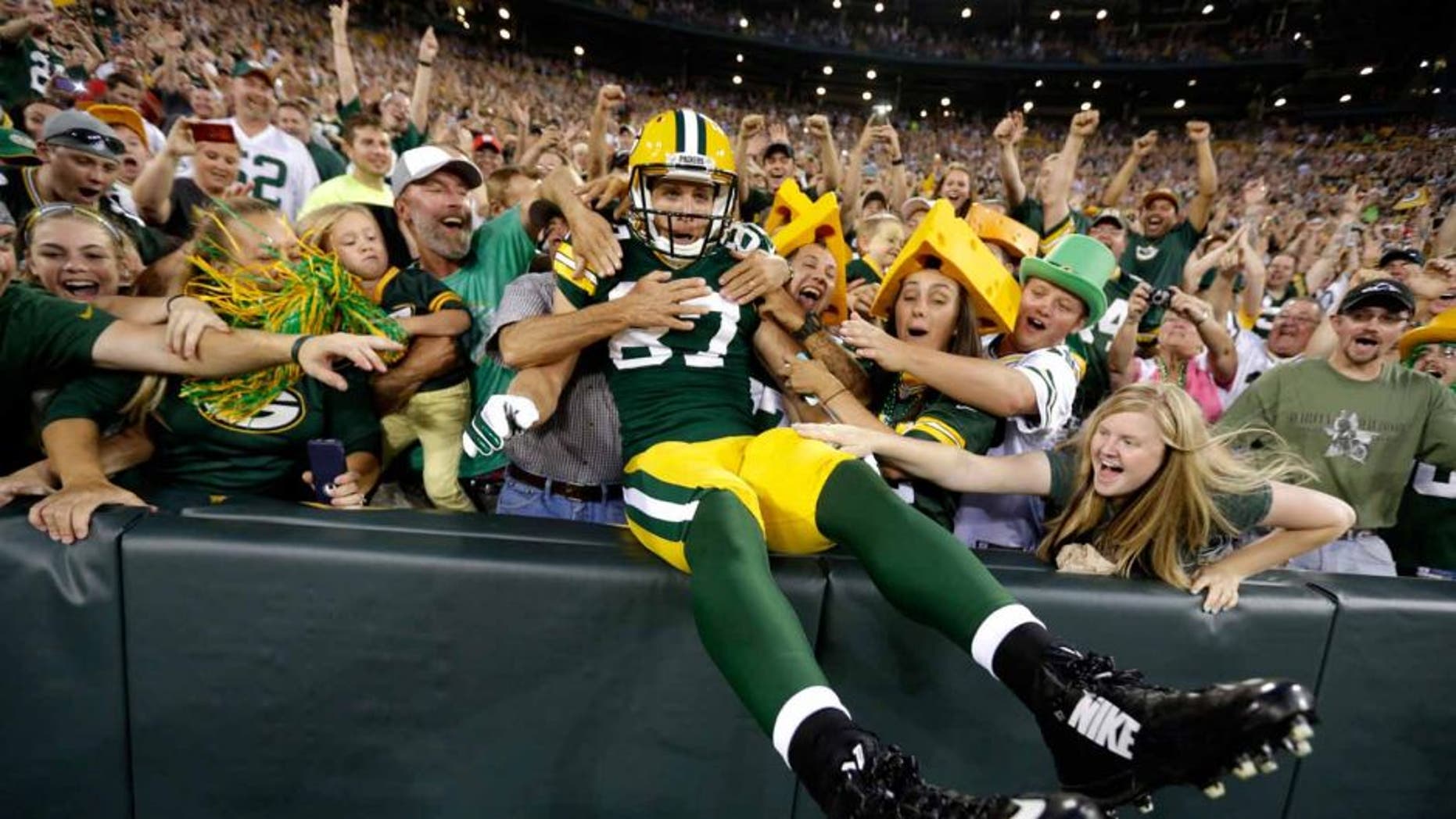 Friday, August 22: Green Bay Packers wide receiver Jordy Nelson celebrates with fans after scoring a touchdown against the Oakland Raiders.