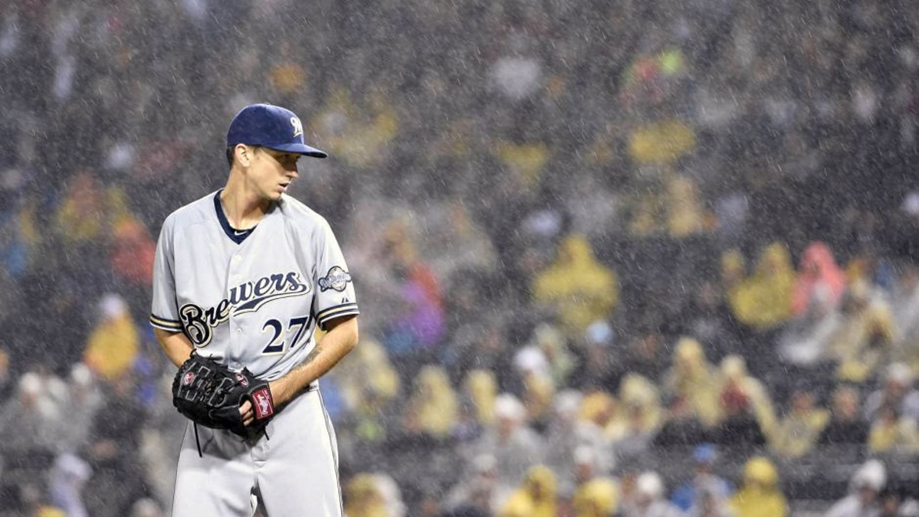 Saturday, Sept. 12, 2015: Milwaukee Brewers pitcher Zach Davies gets set to throw against the Pittsburgh Pirates during a rain storm in the third inning of in Pittsburgh.