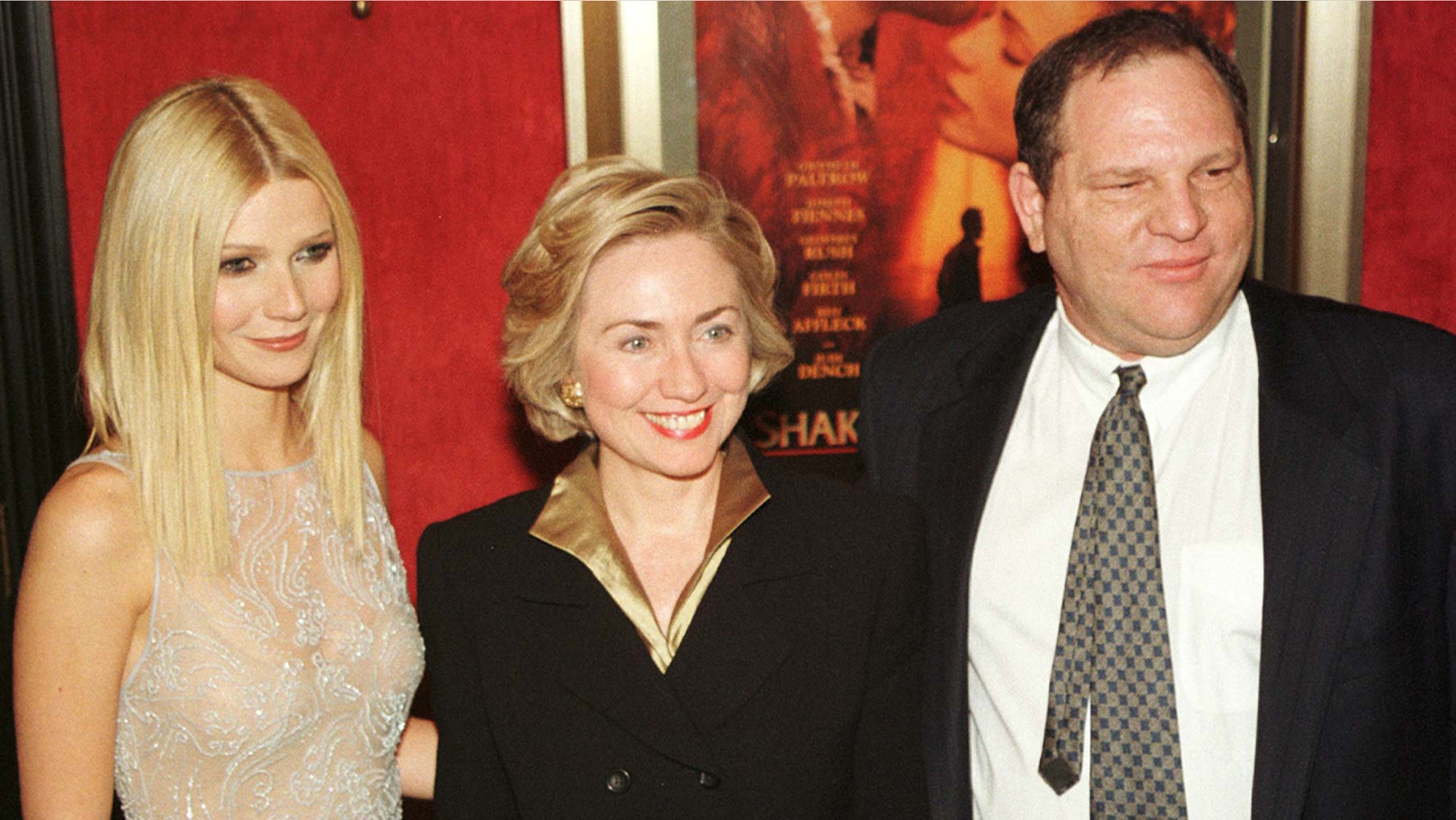 Gwyneth Paltrow (L) poses with then-first lady Hillary Rodham Clinton (C) and former Miramax co-chairman Harvey Weinstein as they arrive for the premiere of "Shakespeare in Love" in New York on December 3, 1998.