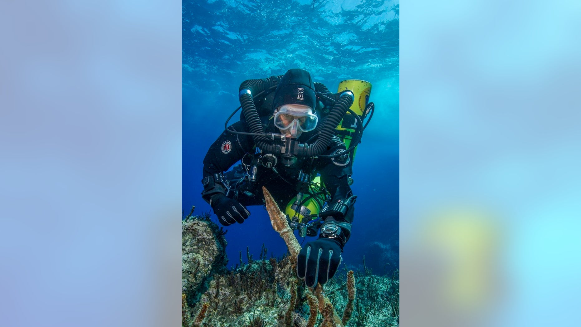Philip Short, the project chief diver of the "Return to Antikythera" mission, inspects the 6.5-foot-long bronze spear recovered from the wreck.