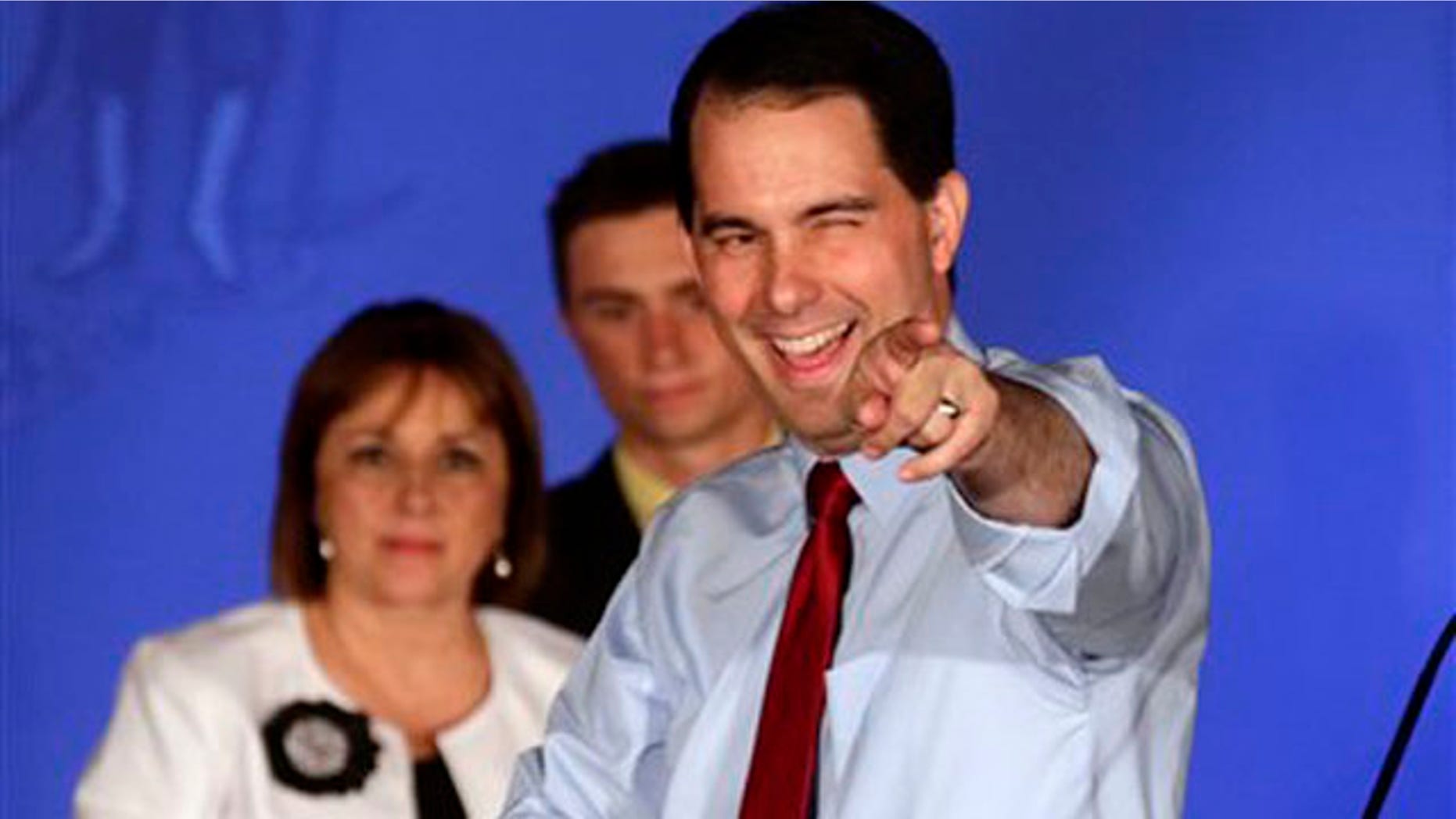 FILE: Wisconsin Republican Gov. Scott Walker reacts at his victory party in Waukesha, Wis., after defeating Democratic challenger Tom Barrett in a special recall election.