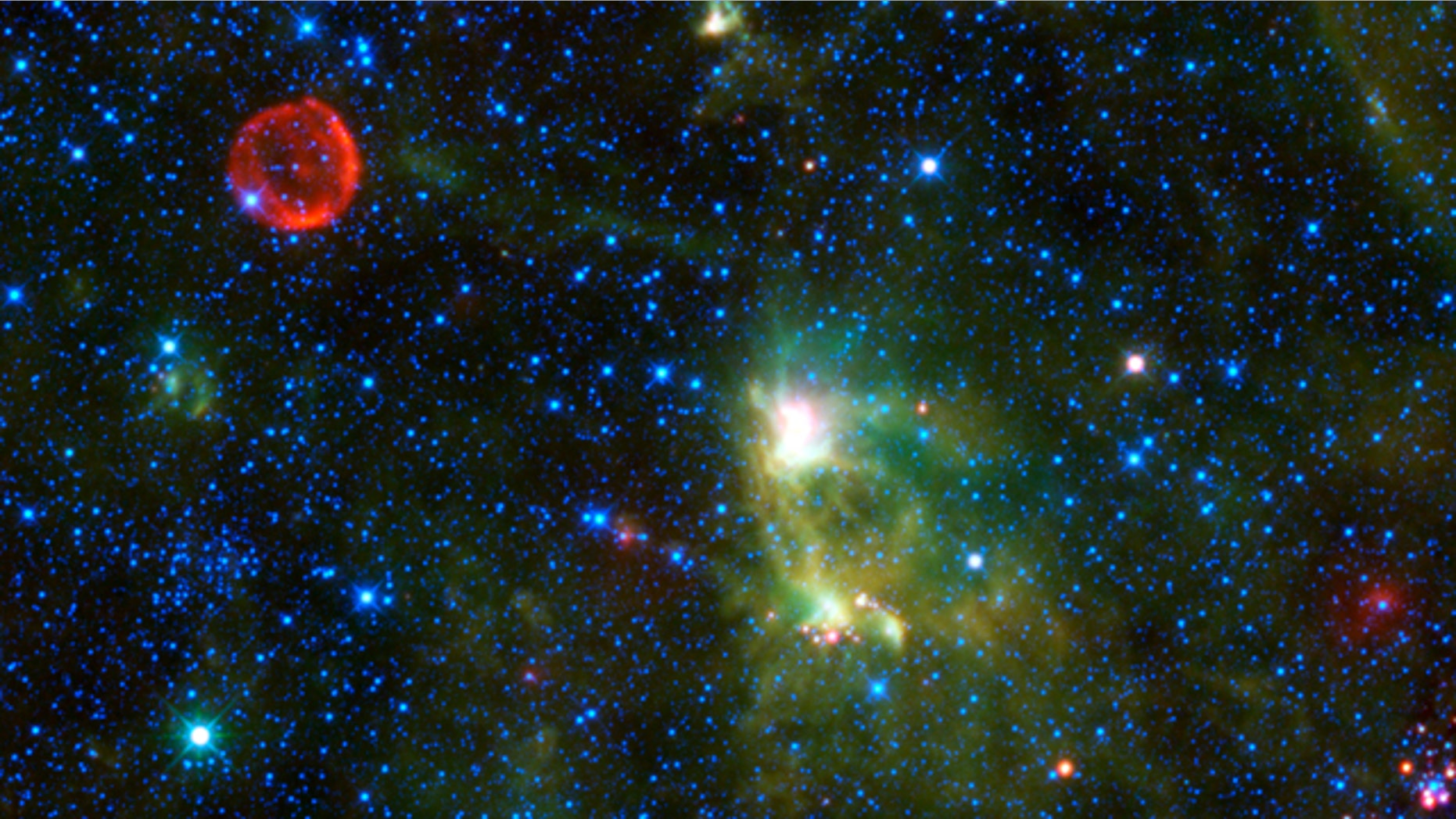 A photo from NASA's Wide-field Infrared Survey Explorer (WISE) takes in several interesting objects in the constellation Cassiopeia. The red circle visible in the upper left part of the image is SN 1572, often called Tycho's Supernova. So far, WISE has discovered 25,000 never-before-seen asteroids. Of those, 95 are considered "near-Earth" asteroids.