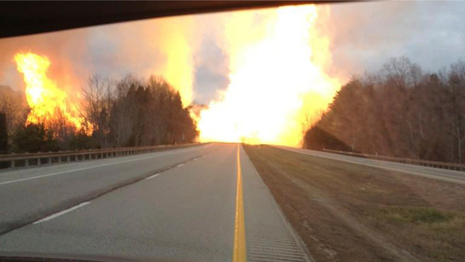 Dec. 11, 2012: This image provided by the Kanawha County Emergency Services shows flames erupting across Interstate 77 from a gas line explosion in Sissonville, W. Va.