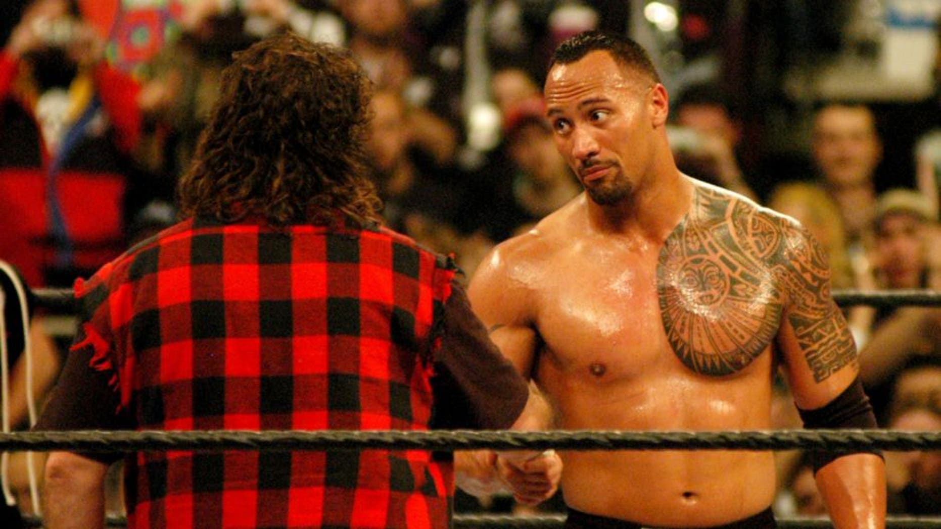 Mick Foley and Dwayne "The Rock" Johnson (Photo by Djamilla Rosa Cochran/WireImage)