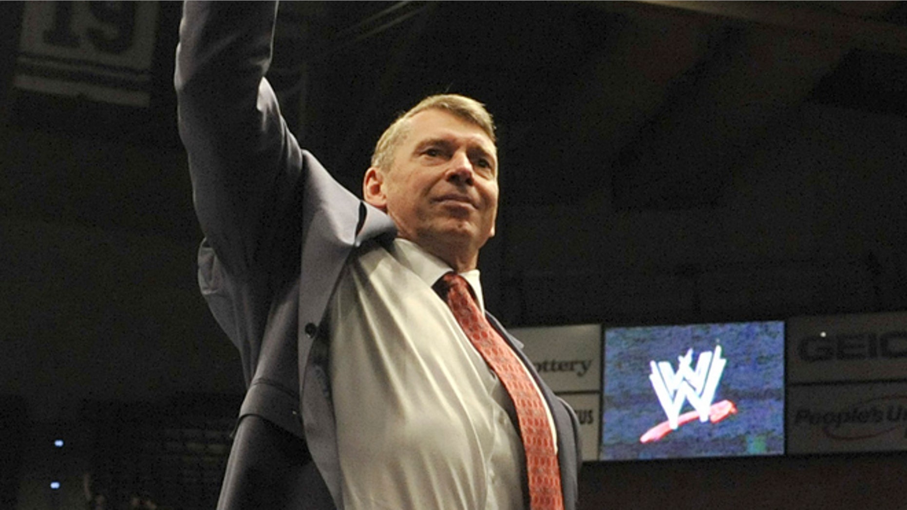 In this Oct. 30, 2010, file photo, World Wrestling Entertainment owner Vince McMahon raises his arm in the air to the audience during a fan appreciation event in Hartford, Conn. (AP Photo/Jessica Hill, File)
