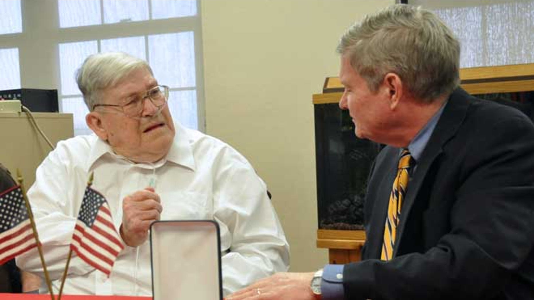May 1, 2013: World War II veteran Charles Bledsoe, 88, left, talks with U.S. Sen. Tim Johnson, D-S.D., as he's awarded a Purple Heart and Bronze Star for injuries sustained in combat at the Veterans Administration hospital in Sioux Falls, S.D.