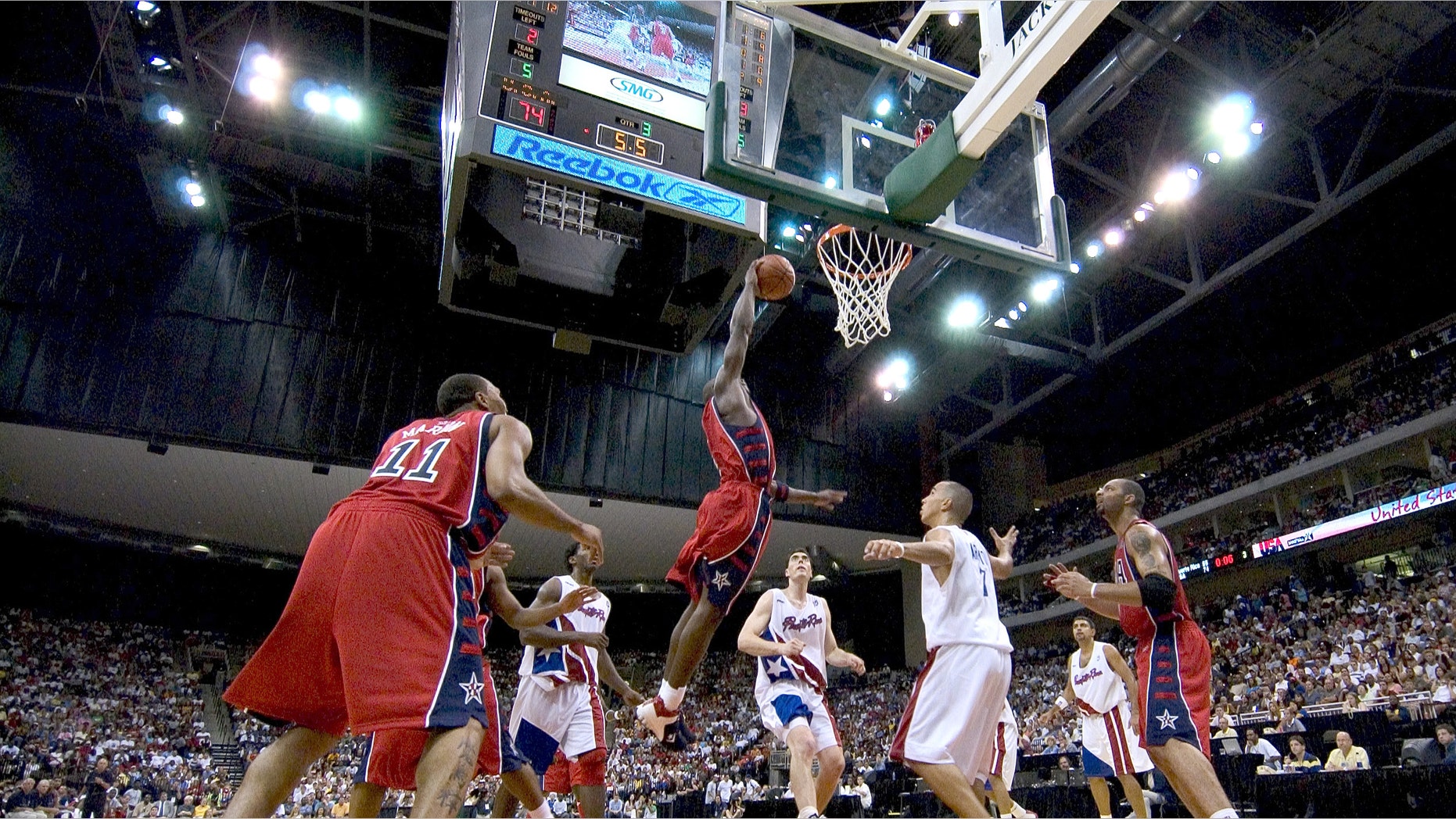 JACKSONVILLE, FL - JULY 31: Dwyane Wade #6 of the USA Basketball Men's Senior National Team drives against the Puerto Rico Senior National Team during their exhibition game on July 31, 2004 at the Jacksonville Veterans Memorial Arena in Jacksonville, Florida. The game is being played in preparation for the 2004 Summer Olympics in Athens, Greece. The U.S. won 96-71. (Photo by Matt Stroshane/Getty Images)