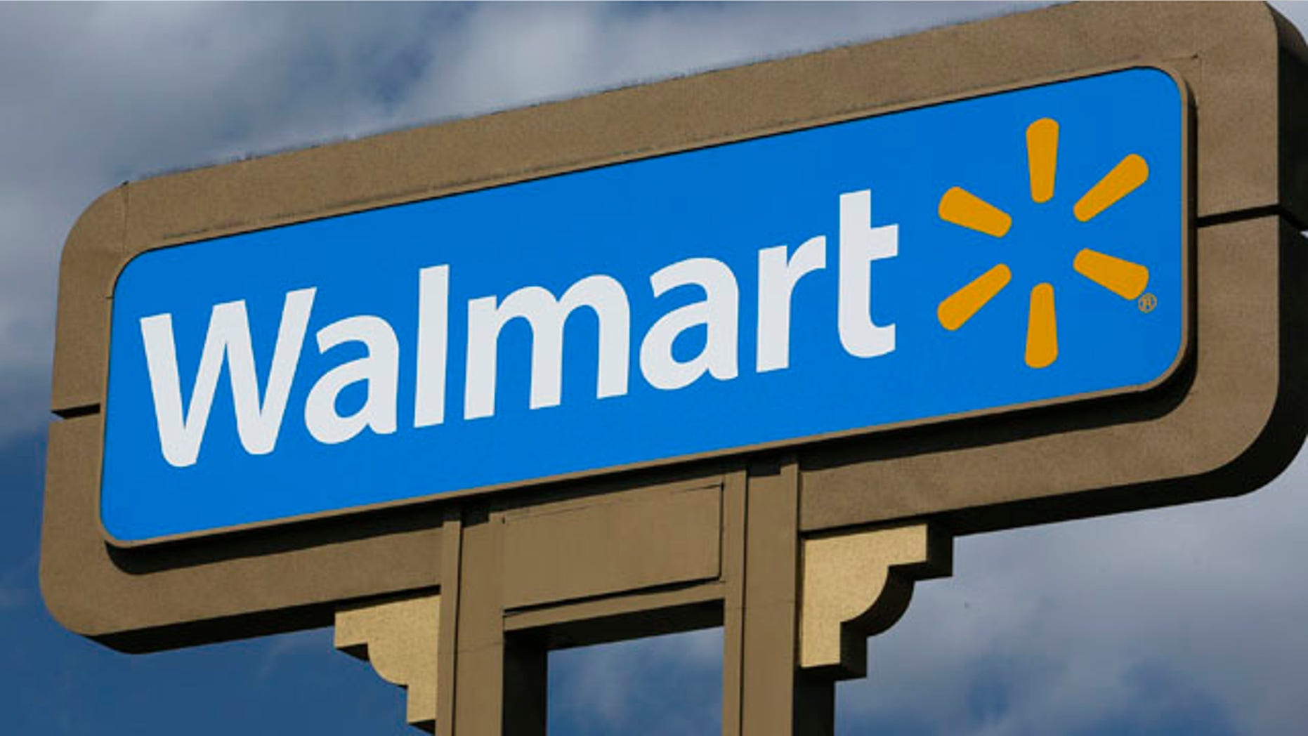 FILE - This May 28, 2013 file photo shows a sign outside a Wal-mart store in Duarte, Calif. (AP Photo/Damian Dovarganes, File)