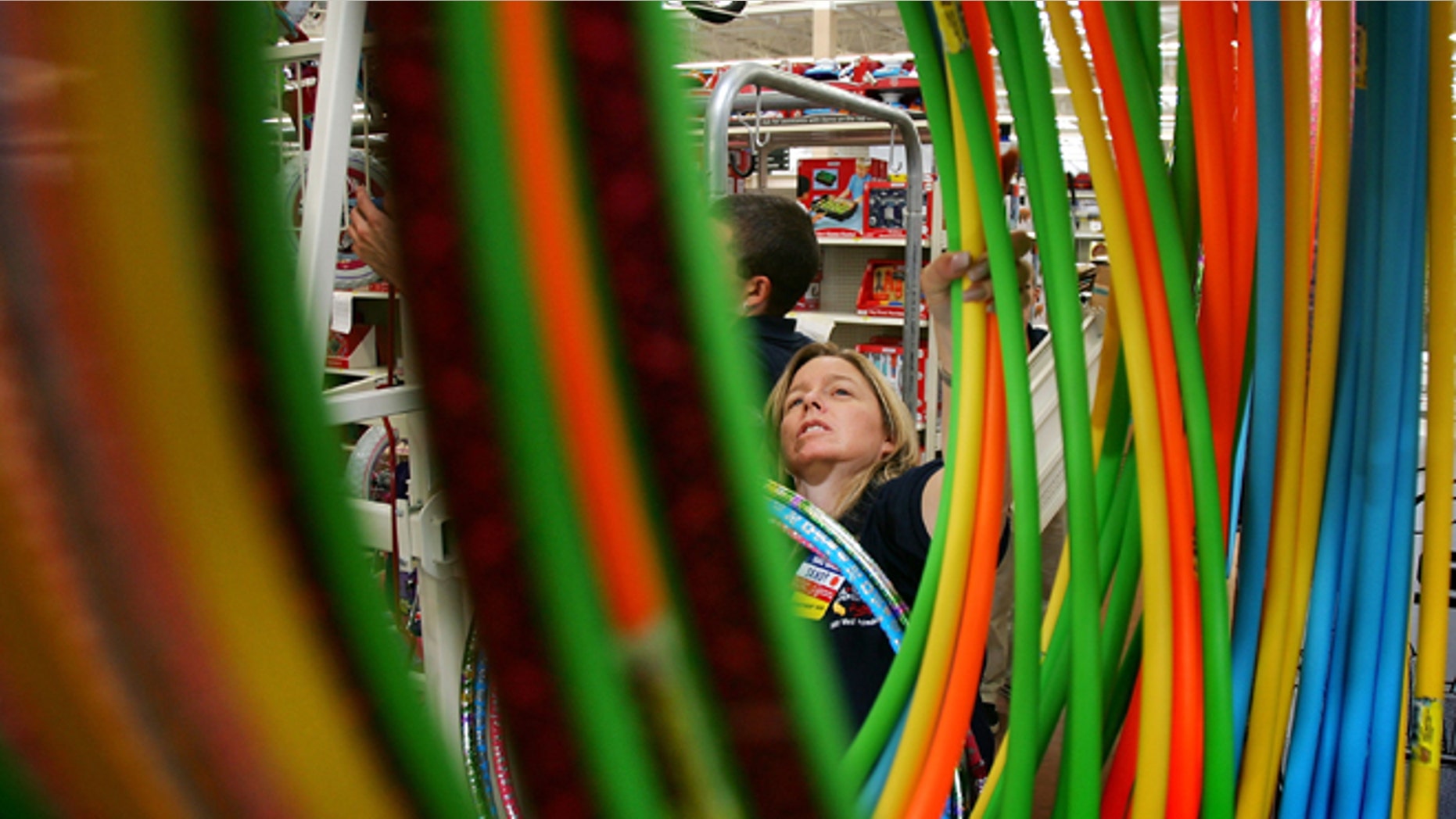 PALMDALE, CA - AUGUST 18: Wal-Mart employee Sandy Johnson stocks merchandise at the soon-to-be-opened Wal-Mart Palmdale Supercenter department store on August 18, 2005 in Palmdale, California. The new 205,000-square-foot store employing 735 people will be open 24 hours a day when it opens to the public. Other Supercenter stores in California are in modest-sized cities such as La Quinta, Hemet, Stockton, and Calexico. (Photo by David McNew/Getty Images)