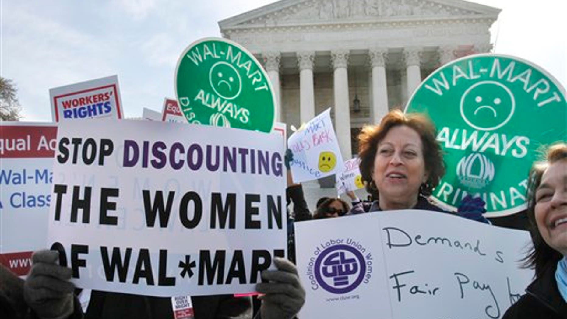 March 30: Protestors rally outside the Supreme Court in Washington, supporting plaintiffs in a case of women employees against Walmart.
