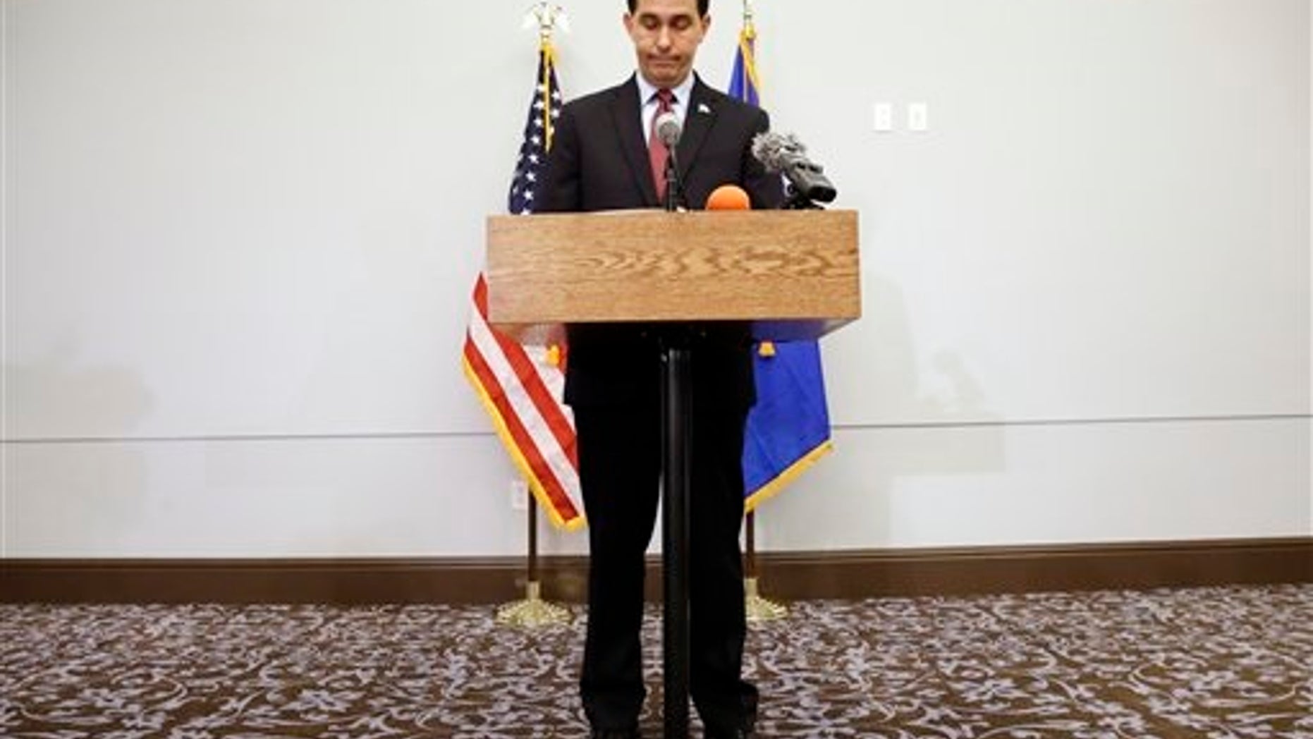 Wisconsin Gov. Scott Walker pauses as he speaks at a news conference Monday, Sept. 21, 2015, in Madison, Wis., where he announced that he is suspending his Republican presidential campaign. (AP Photo/Morry Gash)