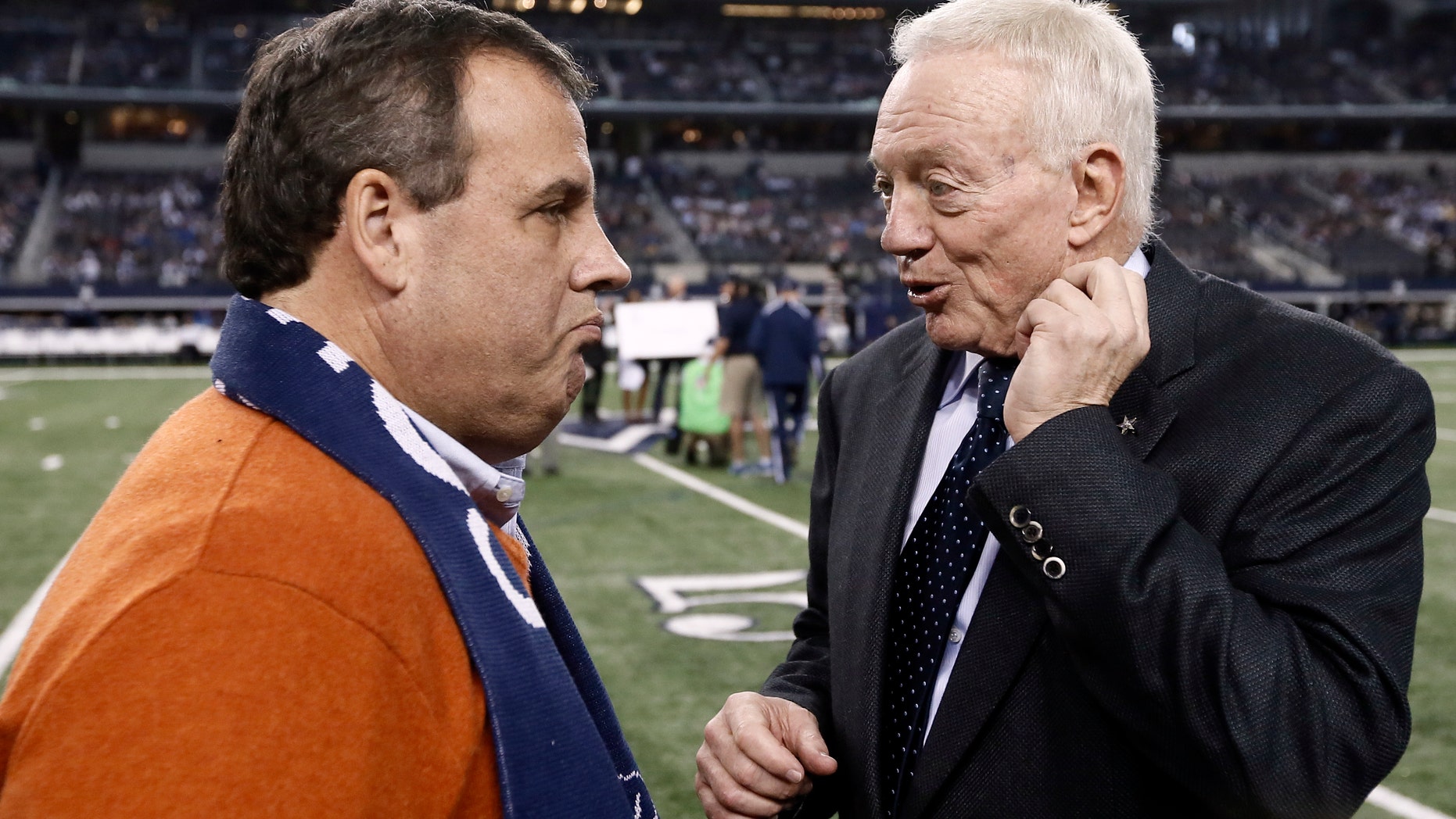 FILE: Dec. 21, 2014: New Jersey Gov. Chris Christie, left, talks with Dallas Cowboys team owner Jerry Jones, at an NFL football game in Arlington, Texas.