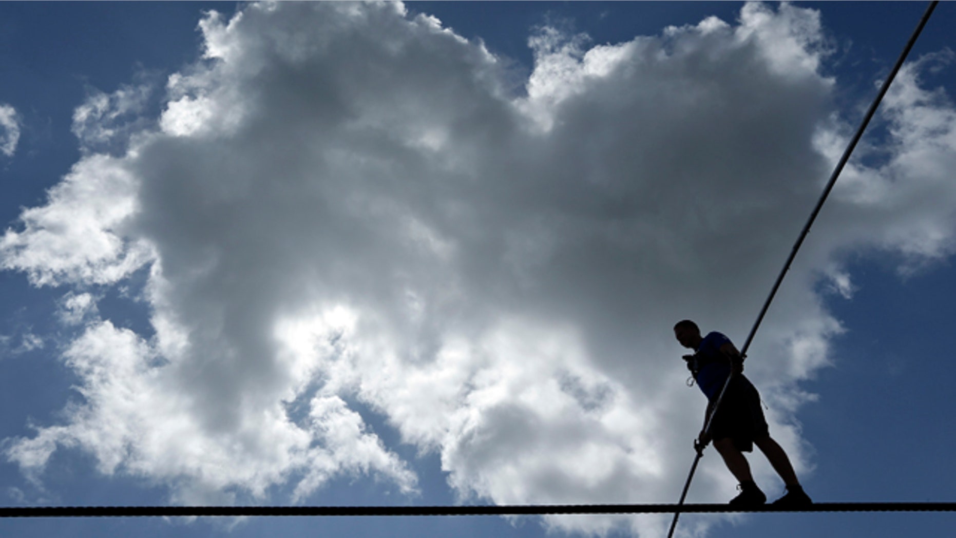 June 18, 2013: High wire performer Nik Wallenda walks across a wire as he practices in Florida.