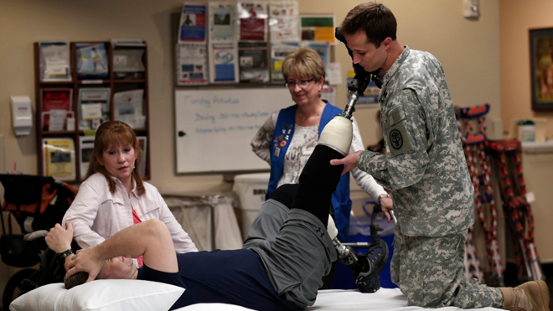 FILE: May 10, 2013: A wounded soldier receives treatment at a rehabilitation center at Walter Reed National Military Medical Center in Bethesda, Md.