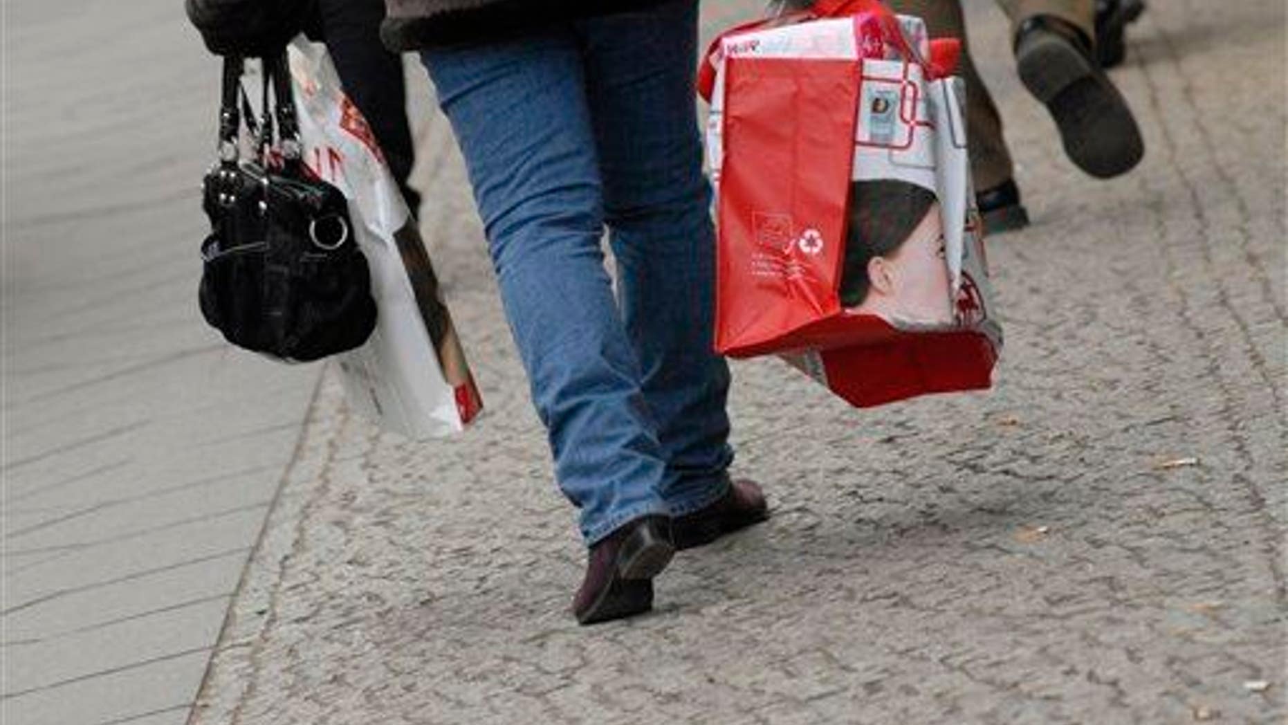 A woman carries shopping bags in Berlin, Germany.