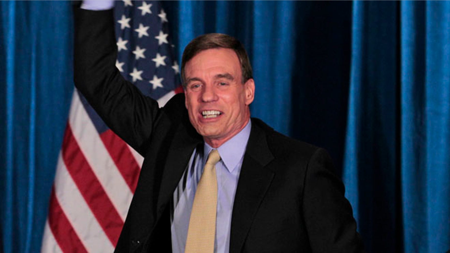 FILE: Nov. 7, 2012: Sen. Mark Warner, D-Va., celebrates Sen.-elect Timothy Kaine's win at victory party in Richmond, Va.