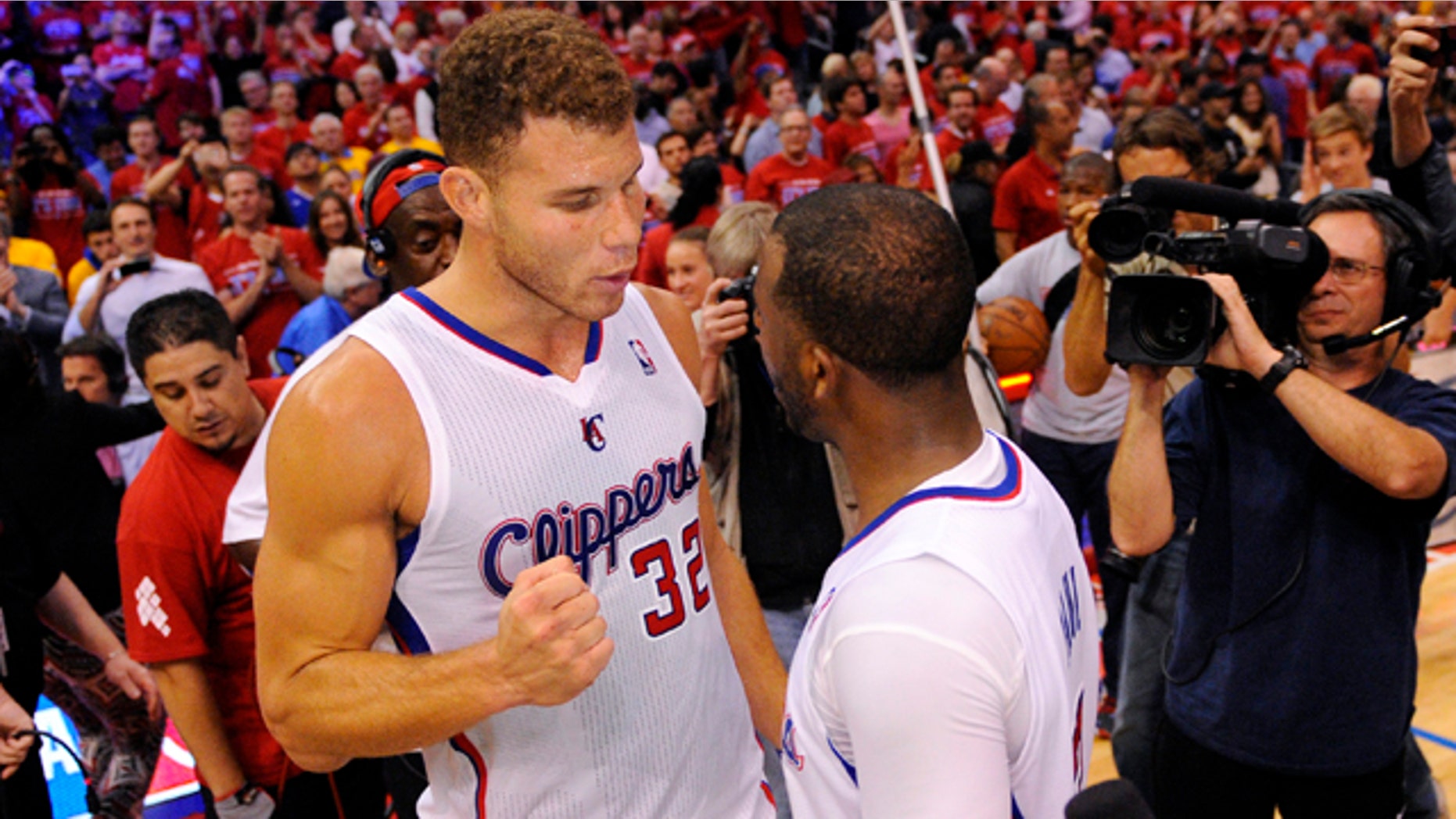 May 3, 2014: Los Angeles Clippers forward Blake Griffin, left, congratulates guard Chris Paul after defeating the Golden State Warriors in Game 7 of an opening-round NBA basketball playoff series in Los Angeles. The Clippers won 126-121. (AP Photo/Mark J. Terrill)
