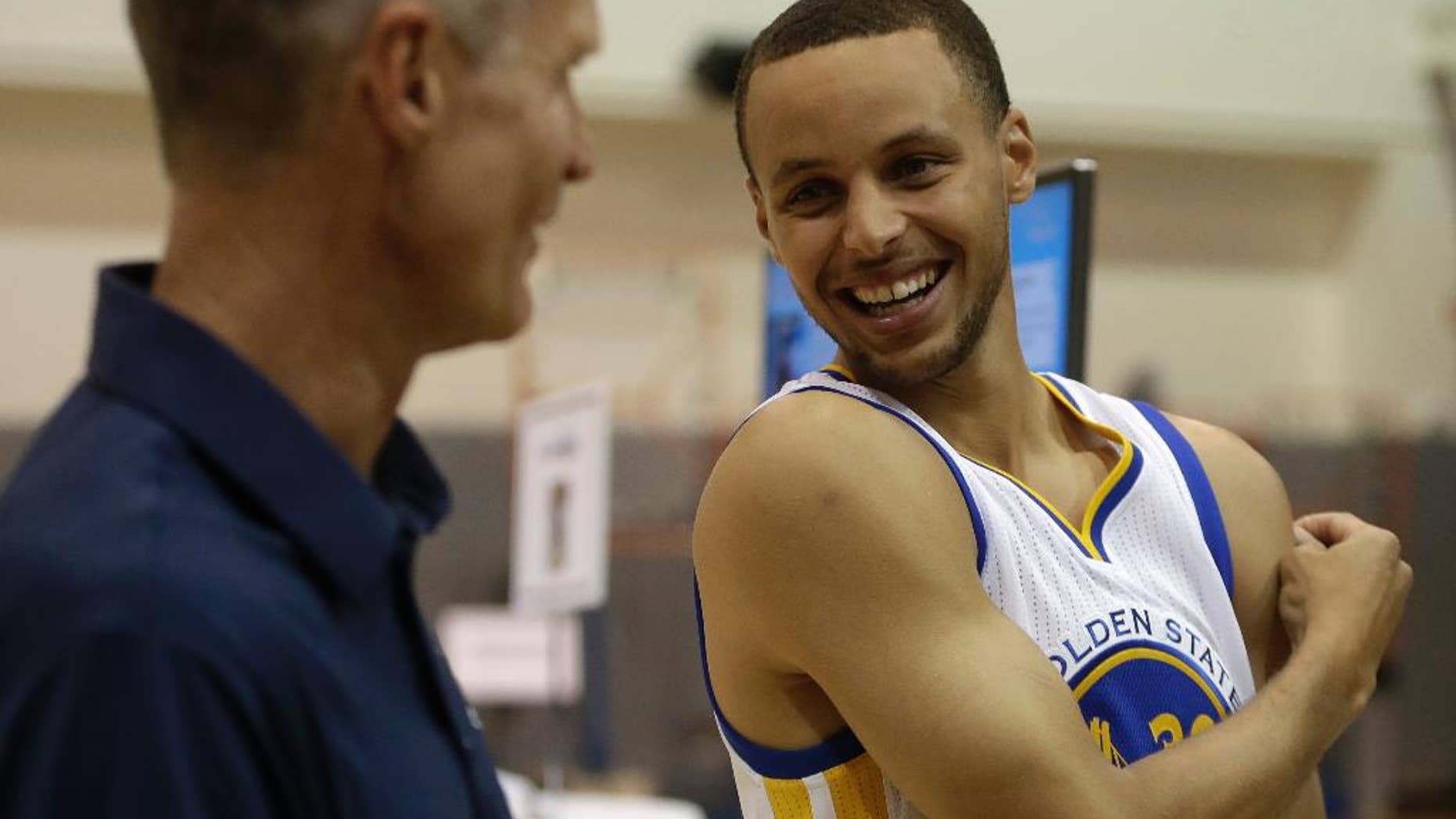 Golden State Warriors' Stephen Curry, right, with coach Steve Kerr.