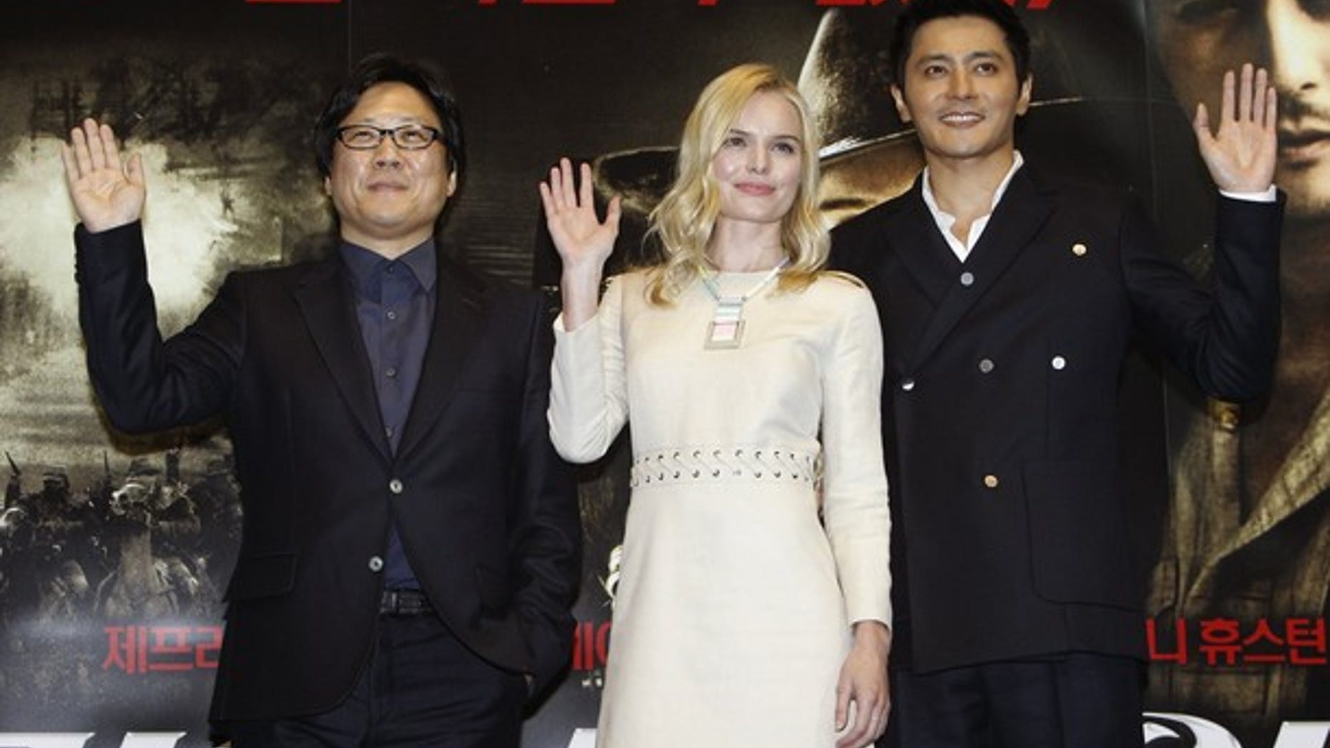 Nov. 22: Director Sngmoo Lee, actress Kate Bosworth and actor Jang Dong-gun pose during a media preview for their new movie 'The Warrior's Way' at a theater in Seoul. (Reuters)
