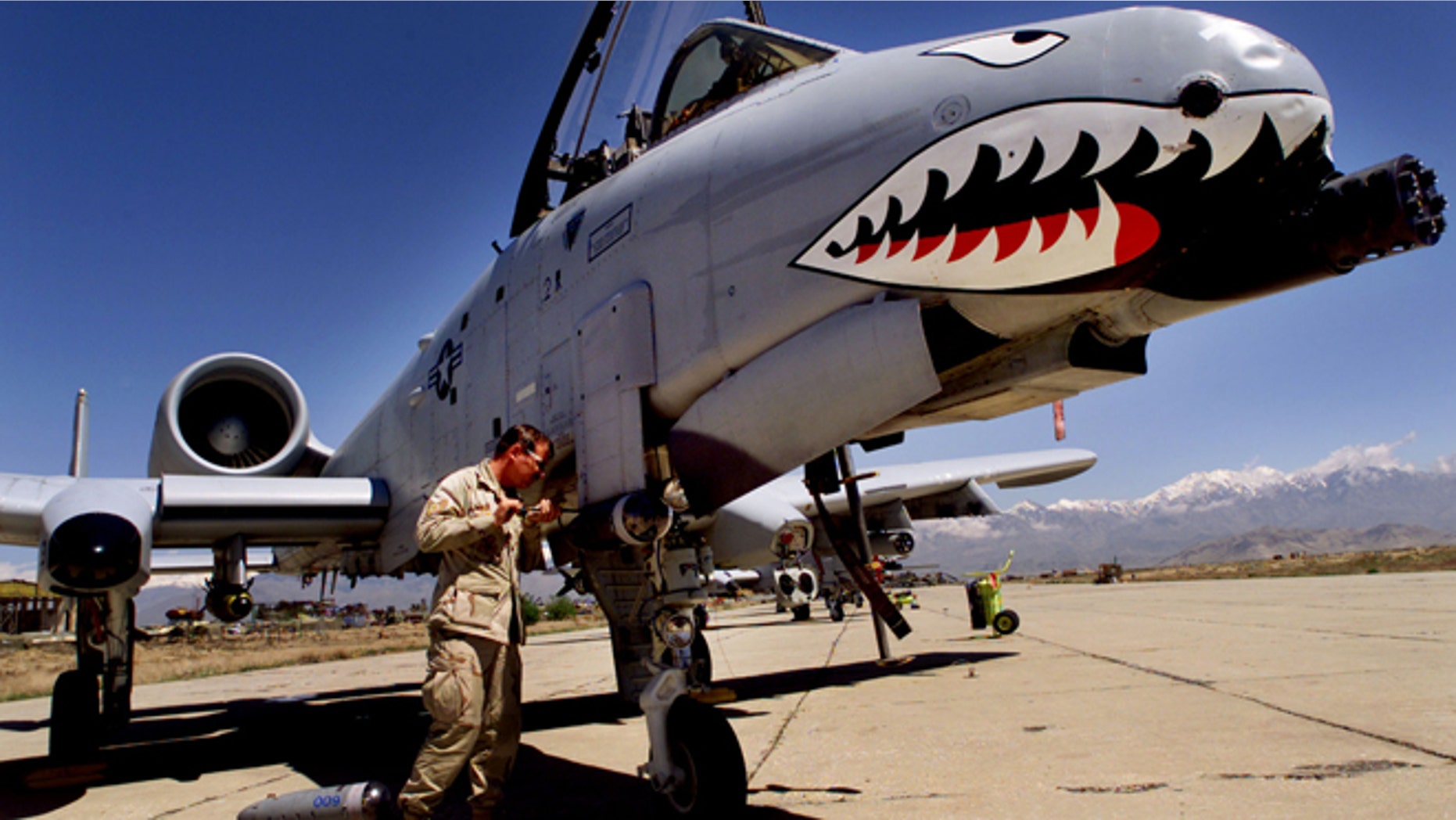 FILE: Staff Sergeant Keith Haas of the US Air Force adjusts equipment on a A-10 Warthog warplane at Bagram Air Base, north of Kabul.