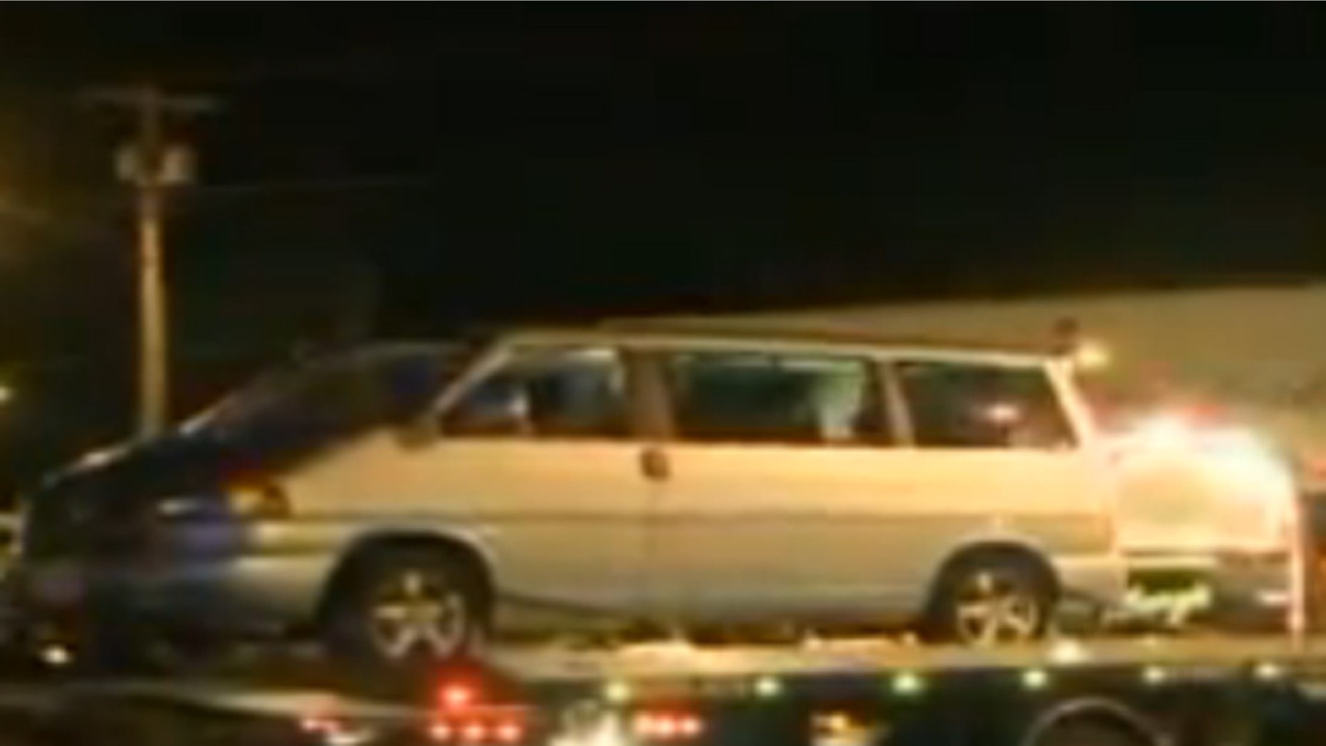 Mar. 11, 2012: Police tow a van as evidence after a police officer's daughter was accidentally shot by her brother inside it.