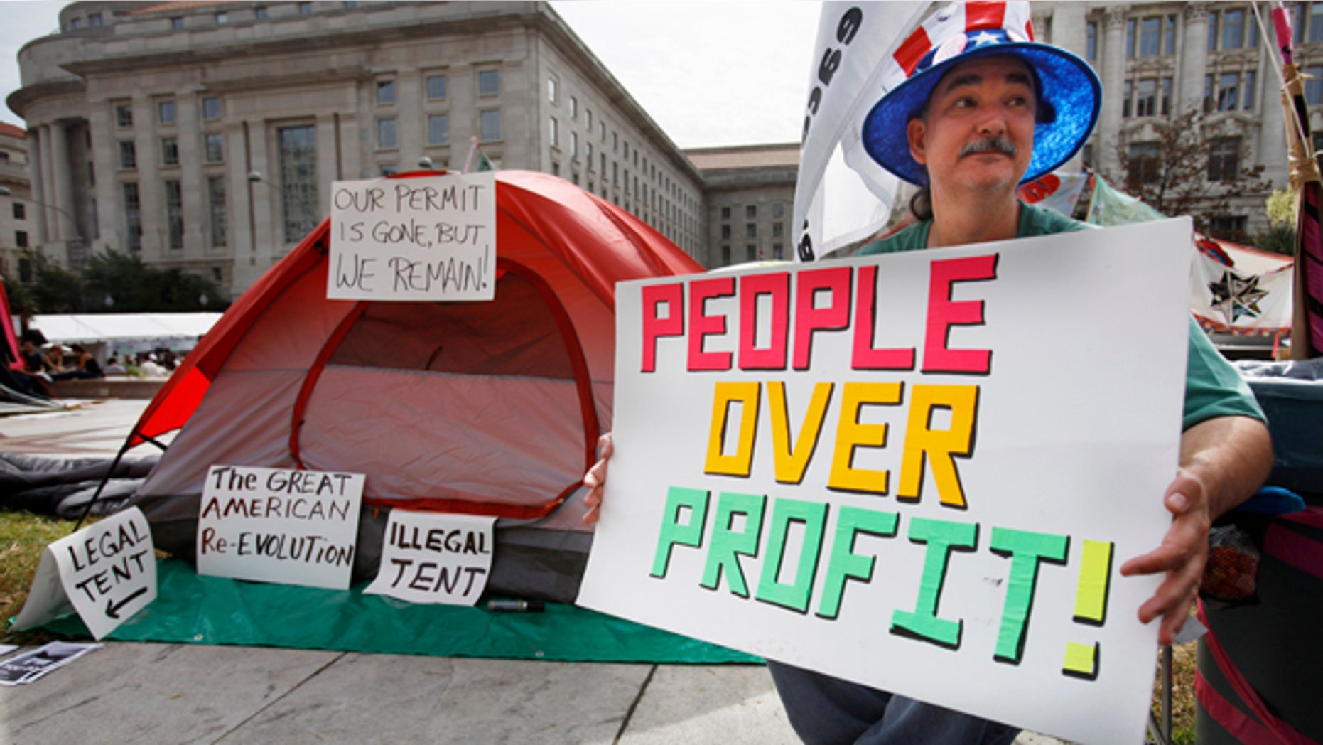 Oct. 10, 2011: Cameron Halket of Dallas sits by his tent set up at Freedom Plaza in Washington.