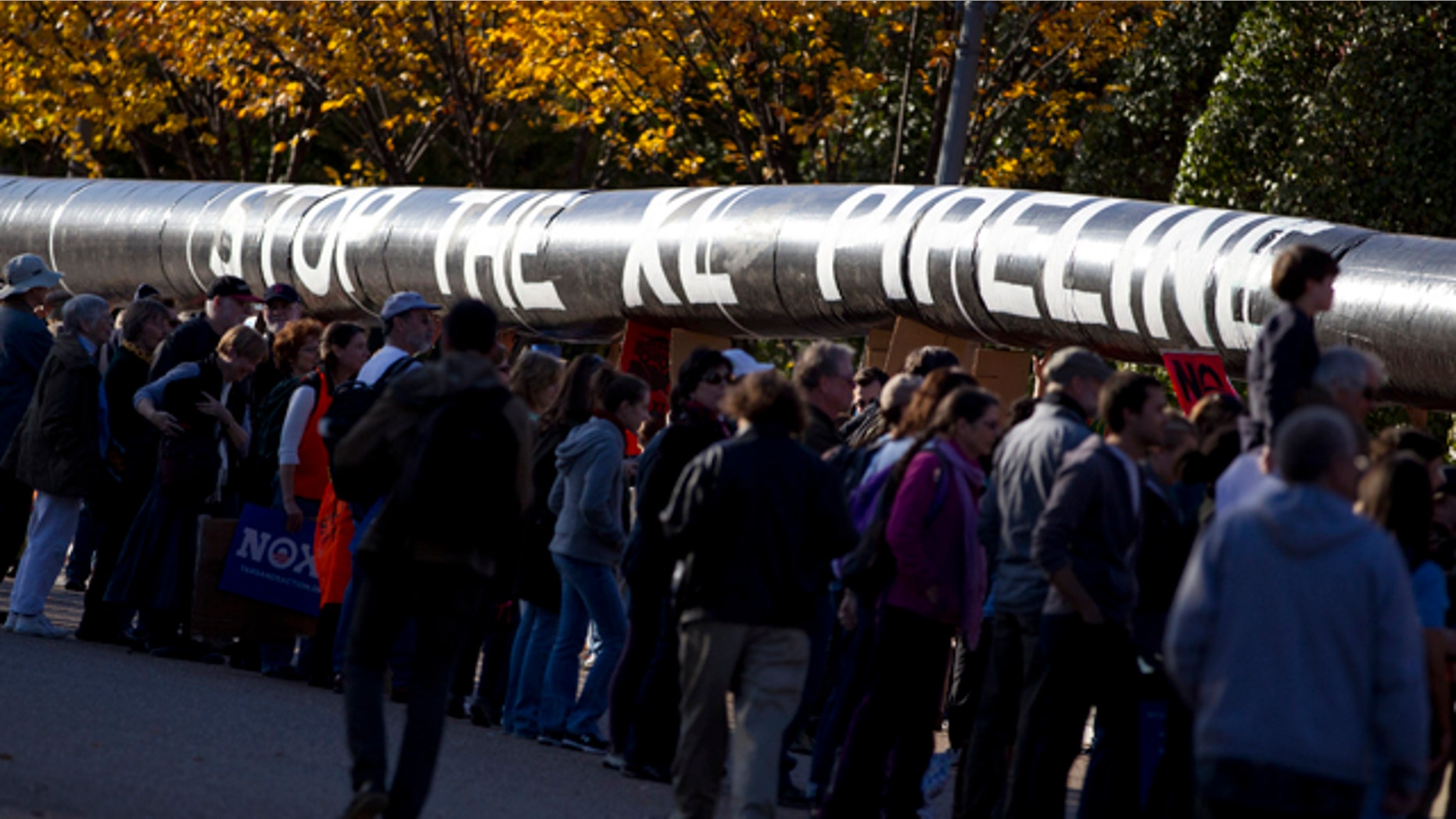Nov. 6, 2011: Demonstrators march with a replica of a pipeline during a protest outside the White House to demand a stop to the Keystone XL oil pipeline.